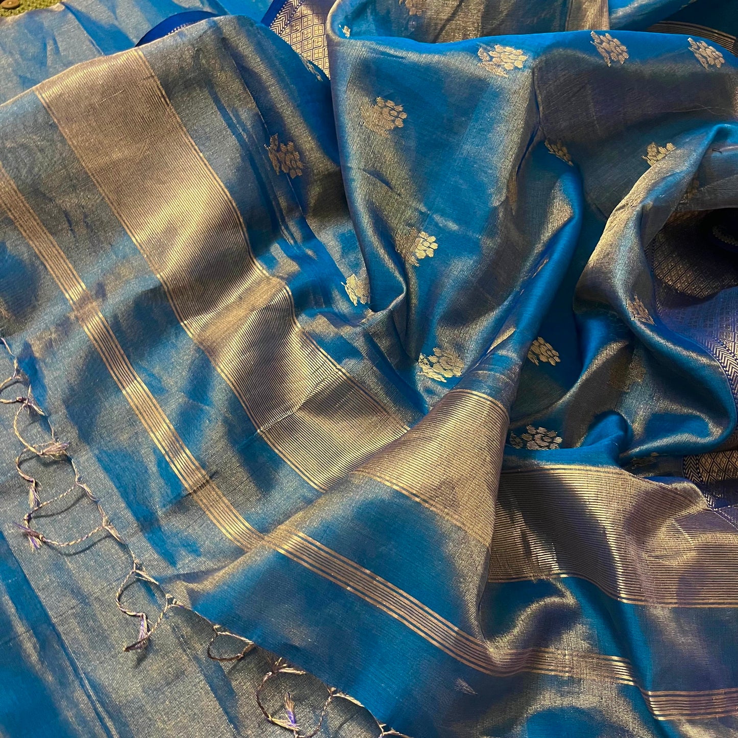 Peacock blue maheshwari tissue silk saree with flower motifs all over