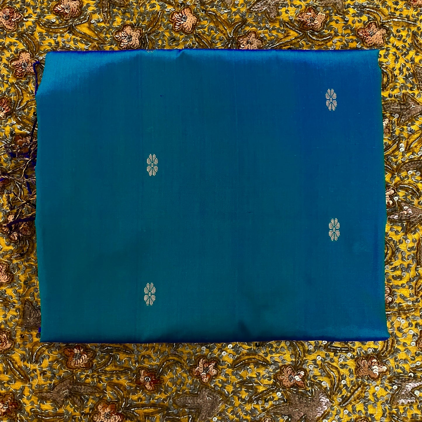 Peacock blue dual tone Maheshwari silk saree with flower bootis all over