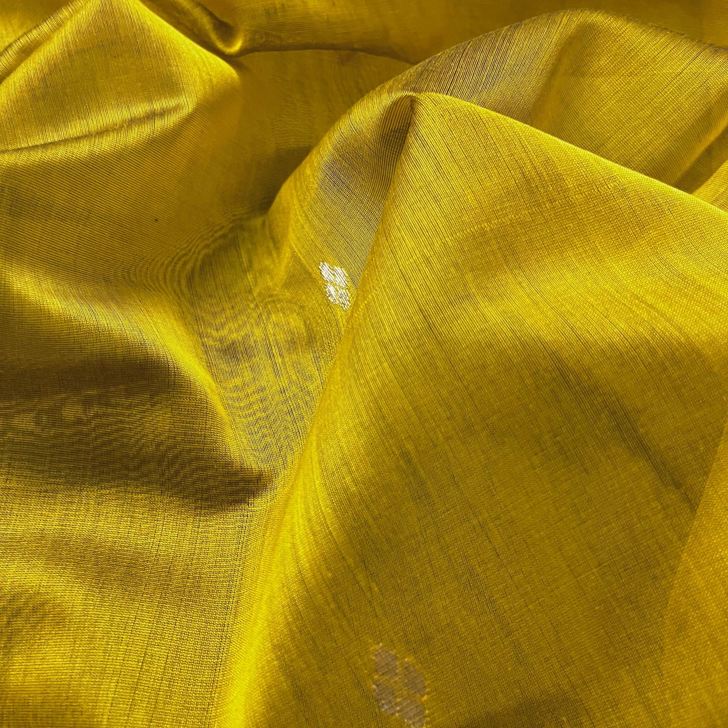 Mustard and green Maheshwari saree with flower motifs on pallu