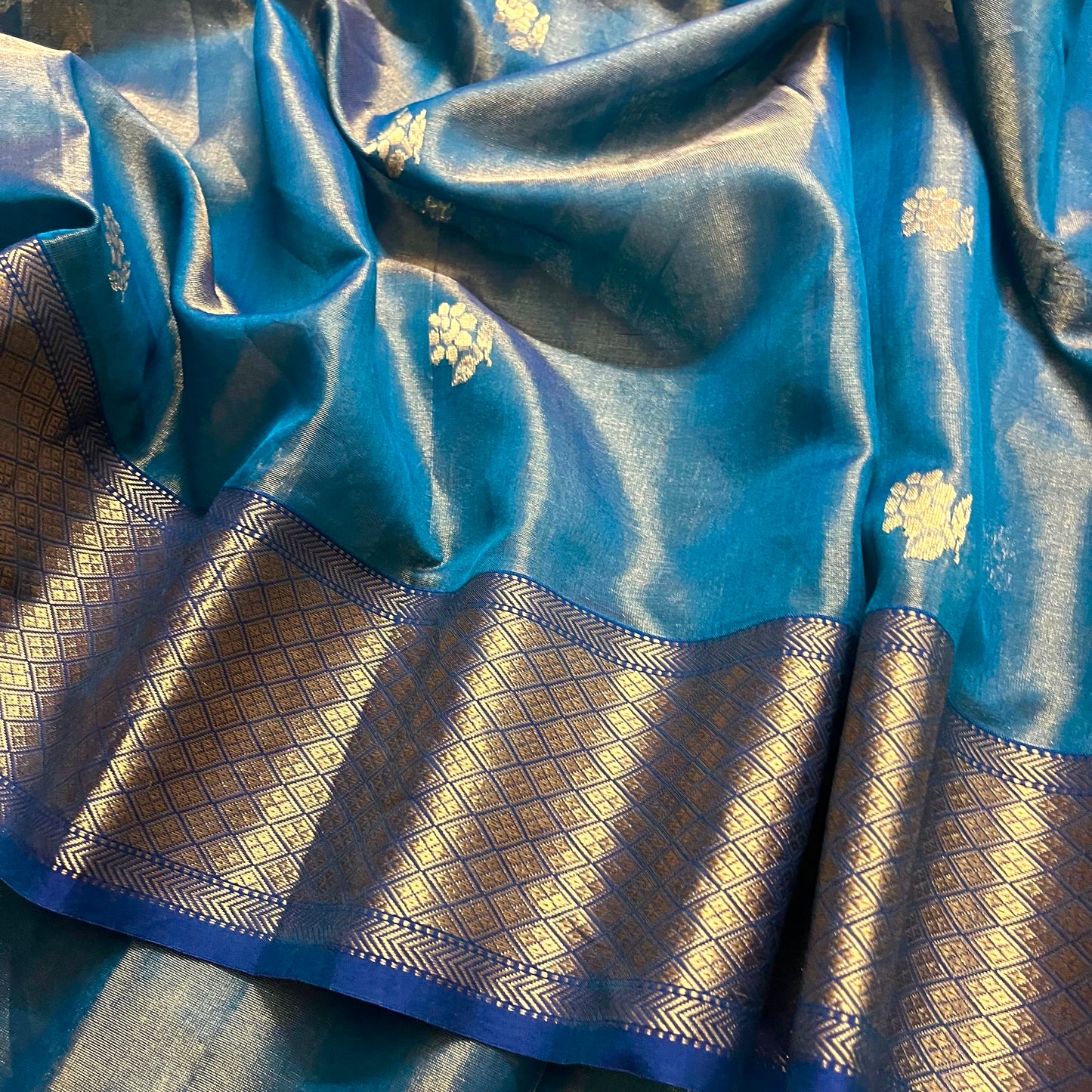 Peacock blue maheshwari tissue silk saree with flower motifs all over