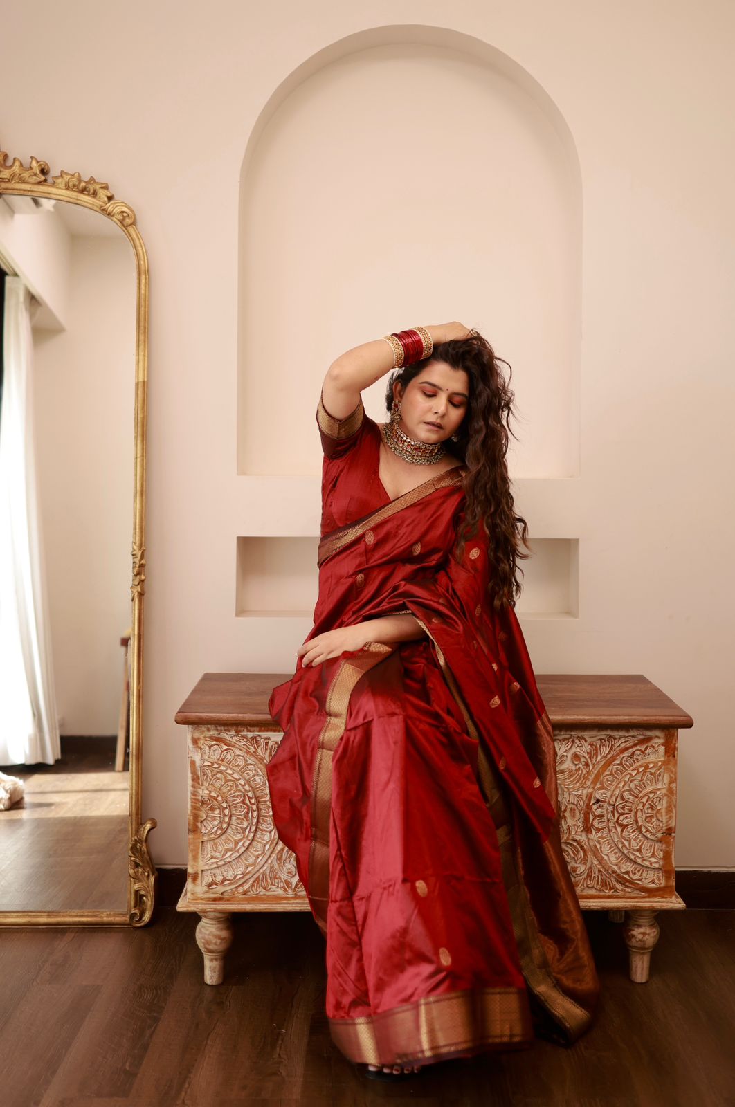 Deep maroon Maheshwari silk saree with zari bootis all over