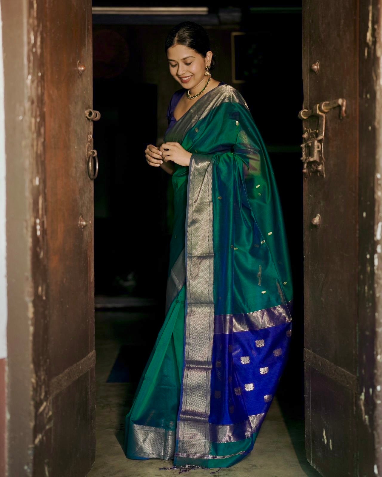Dark Green and blue maheshwari dual tone saree with flower bootis all over