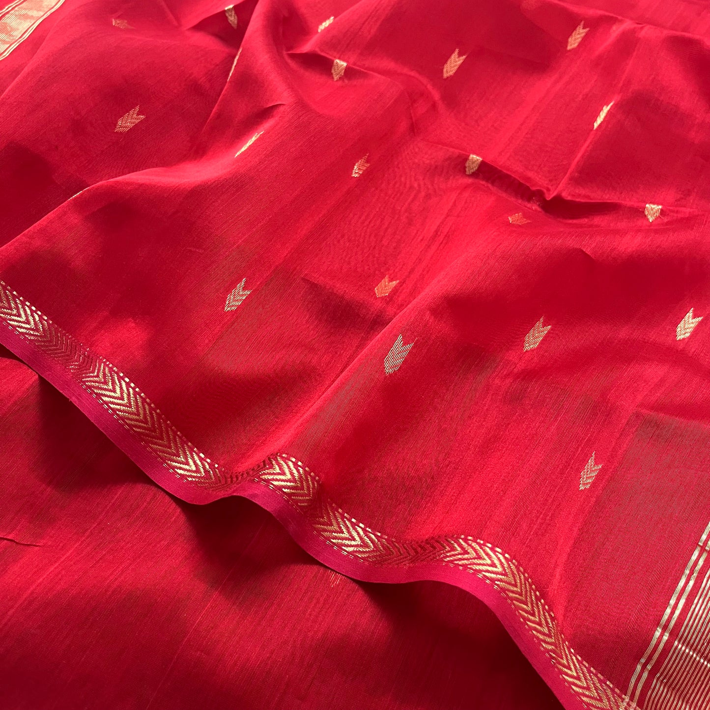 Red maheshwari saree with zari border & zari bootis all over