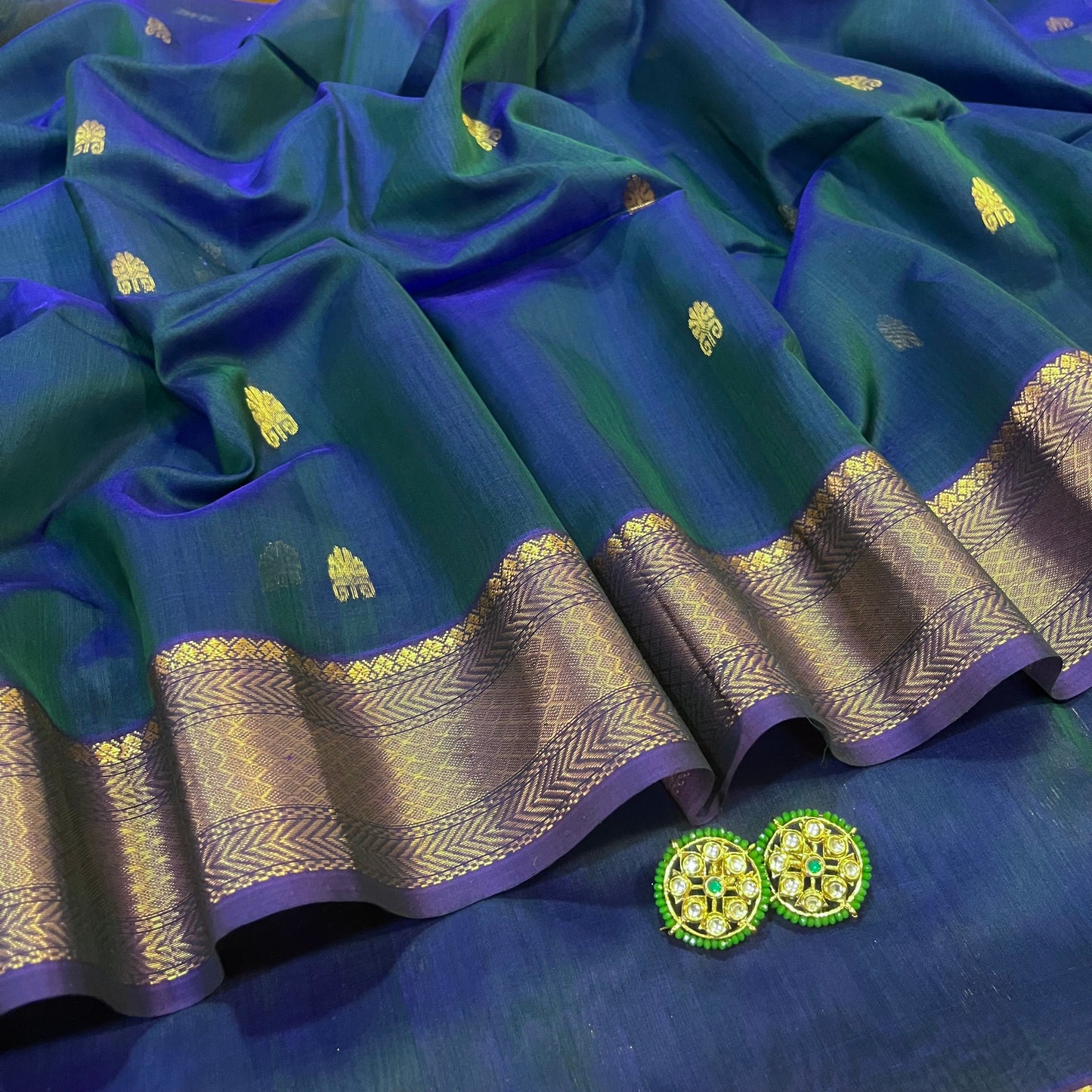 Peacock and purple dual tone Maheshwari saree with zari motifs all over