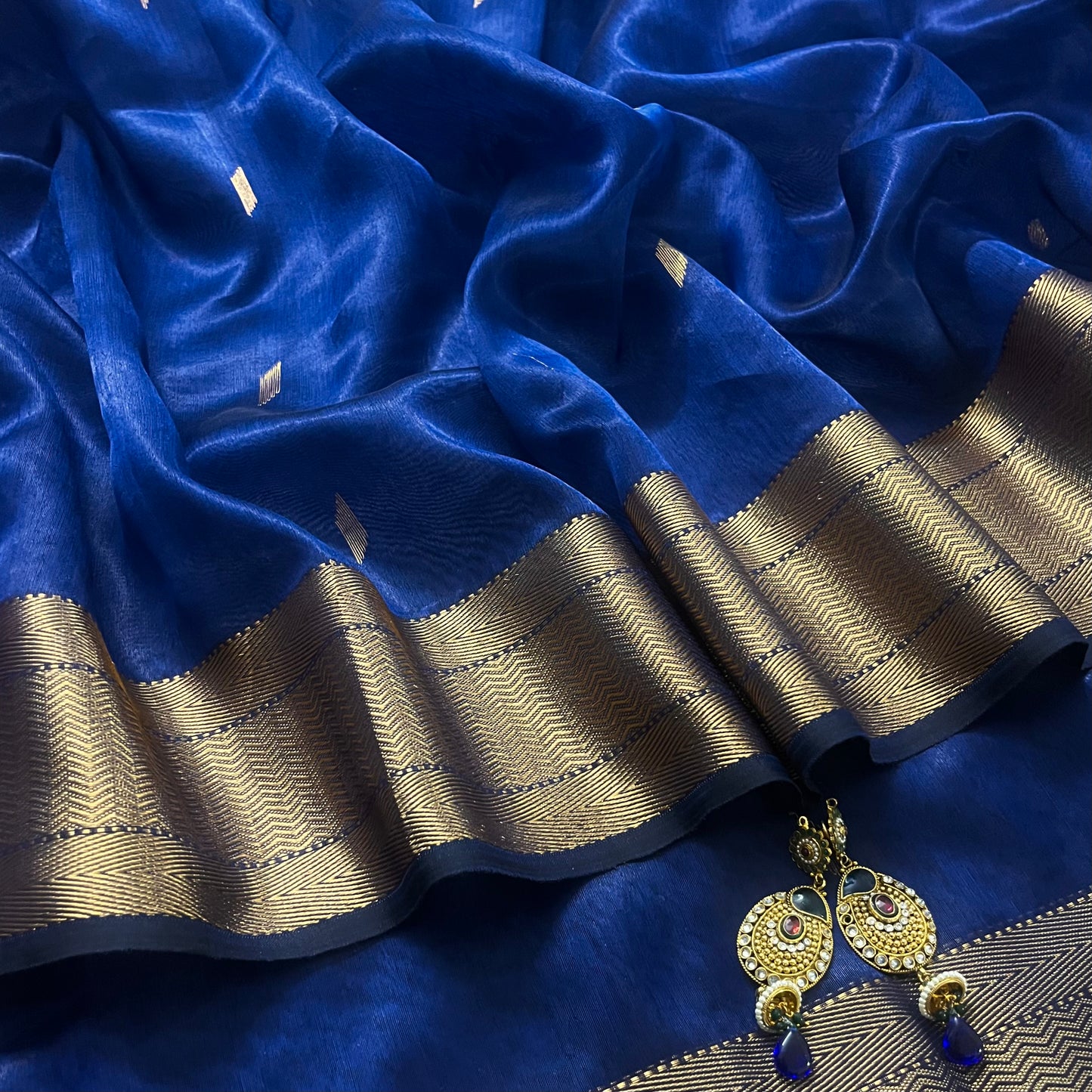 Dark blue Maheshwari tissue silk saree with zari bootis all over
