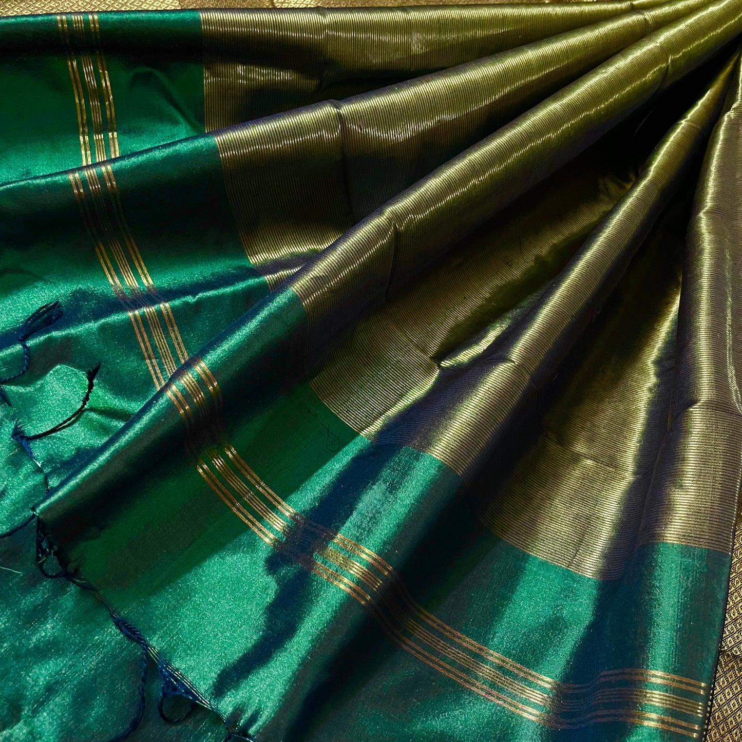 Dark green maheshwari silk saree with zari bootis all over
