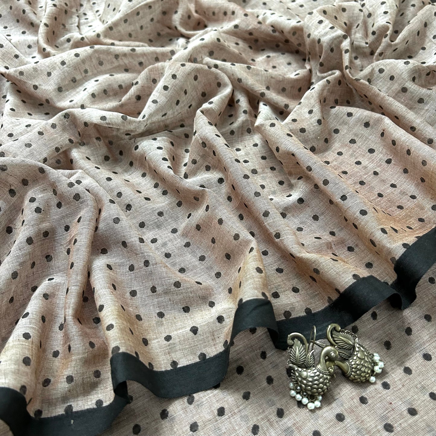 Greyish beige and black polka dot mulmul saree