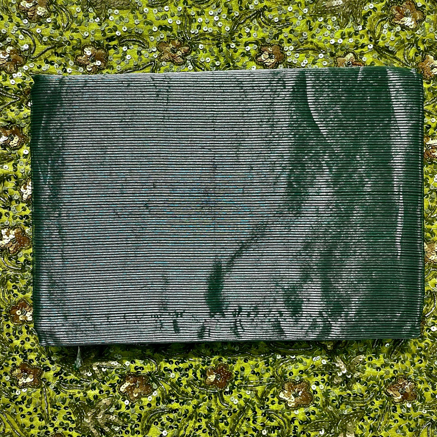 Dark green Maheshwari saree with silver zari lines all over