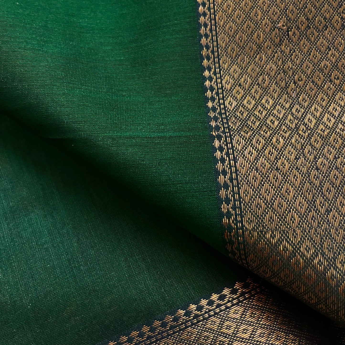 Dark green maheshwari with saree with flower bootis all over