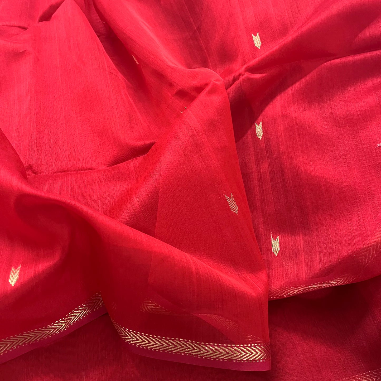 Red maheshwari saree with zari border & zari bootis all over