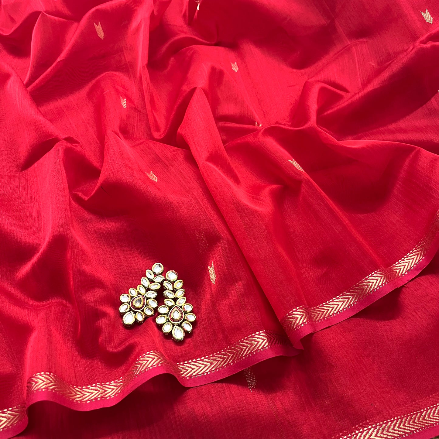 Red maheshwari saree with zari border & zari bootis all over