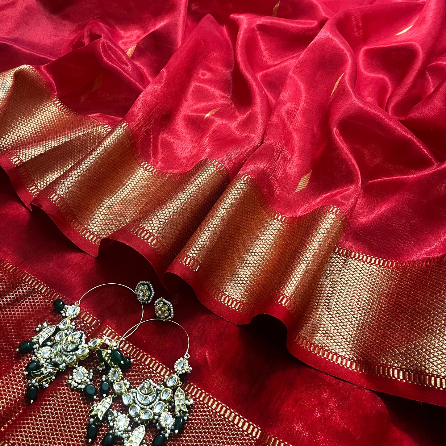 Red Maheshwari tissue silk saree with zari bootis all over