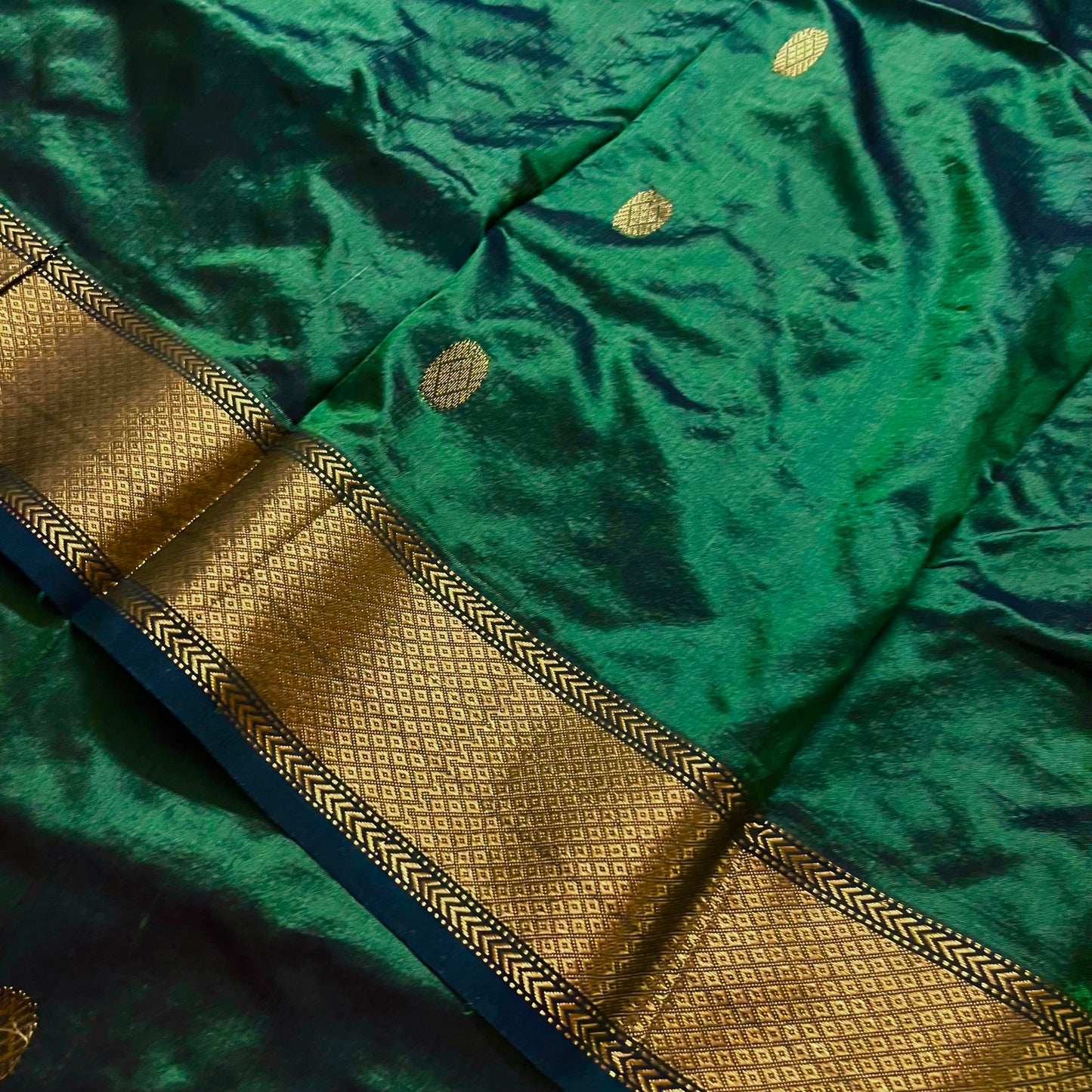 Dark green maheshwari silk saree with zari bootis all over