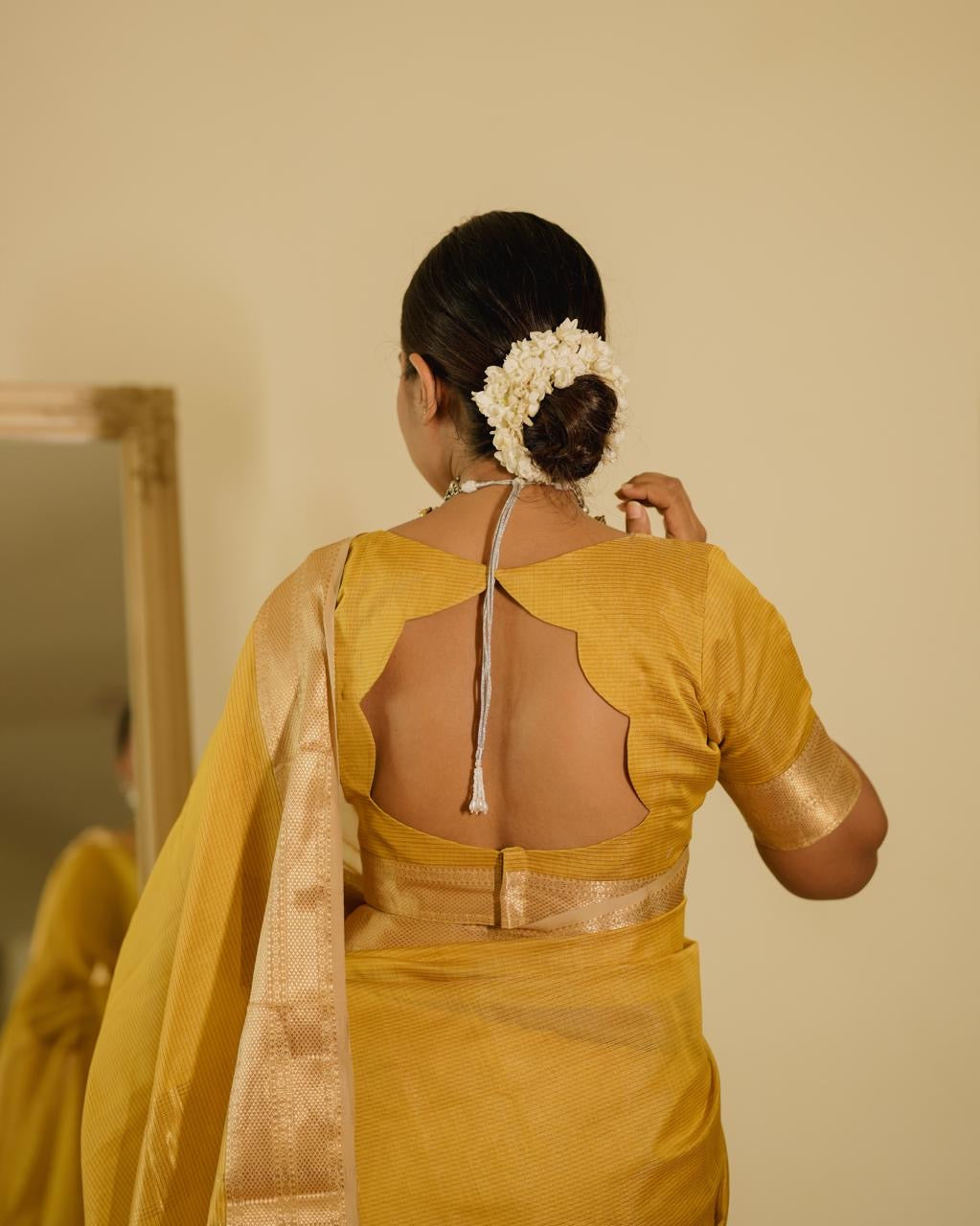 Yellow Maheshwari saree with zari lines all over