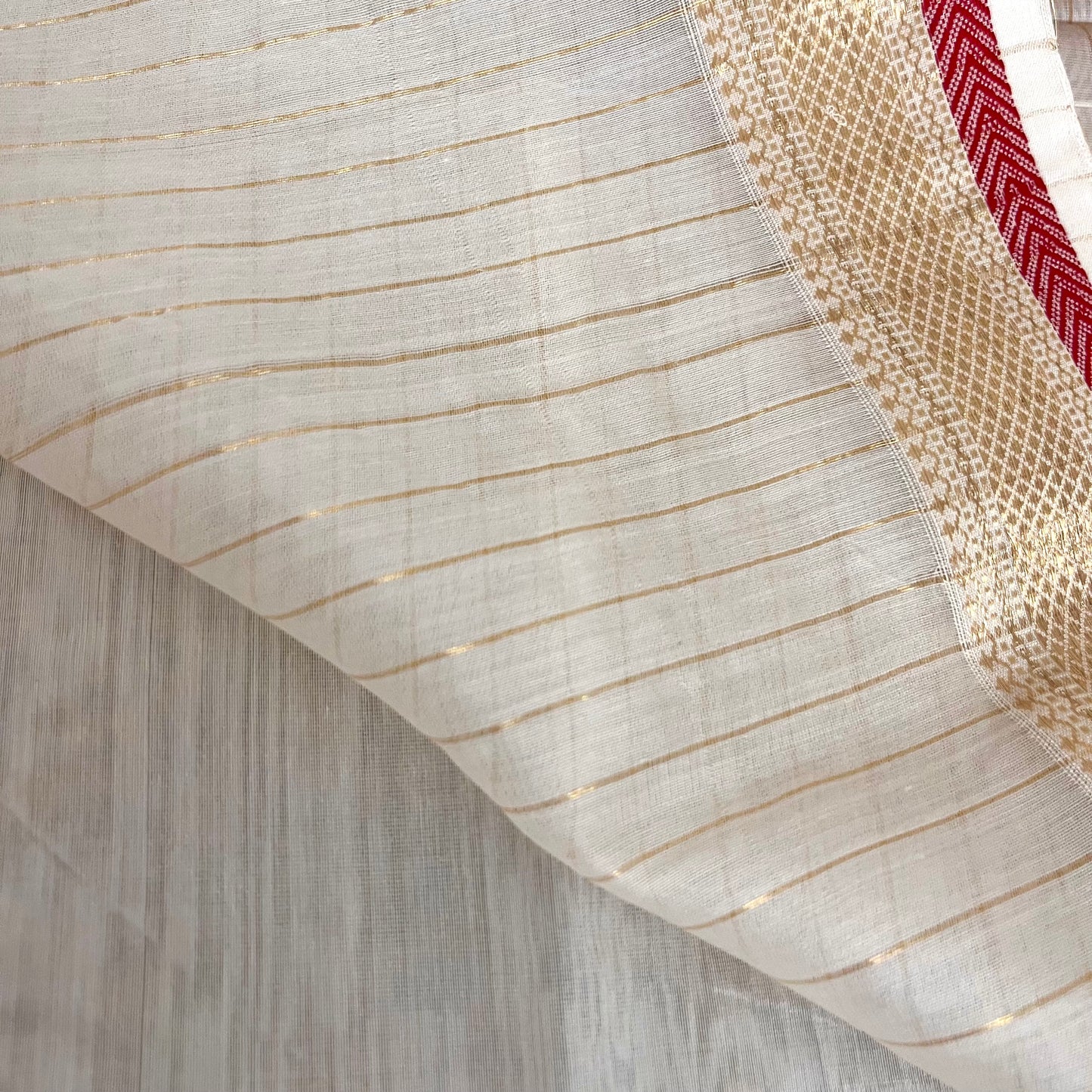White and red Maheshwari saree with zari border