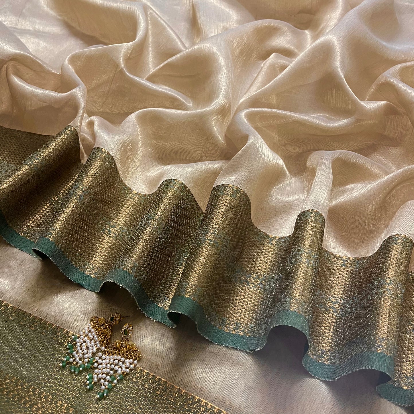 Gold and green Maheshwari tissue silk saree with zari pattern on pallu
