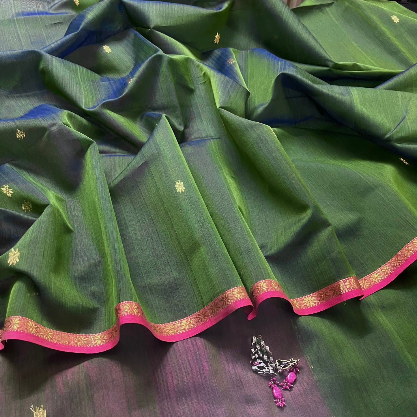 Green and pink Maheshwari saree with flower bootis all over