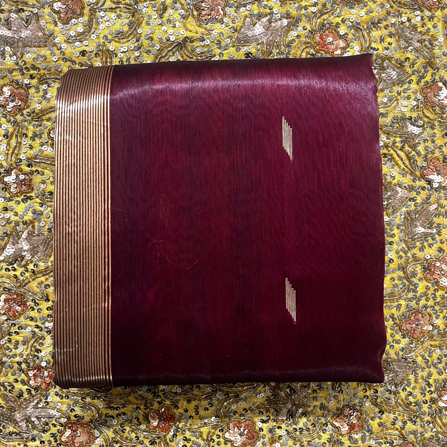 Mahogany Maheshwari tissue silk saree with zari bootis all over