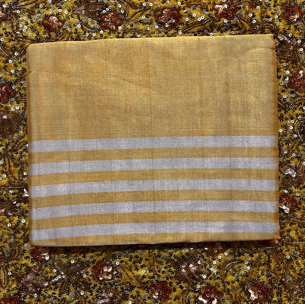 Gold and silver chanderi tissue silk saree with zari stripes all over
