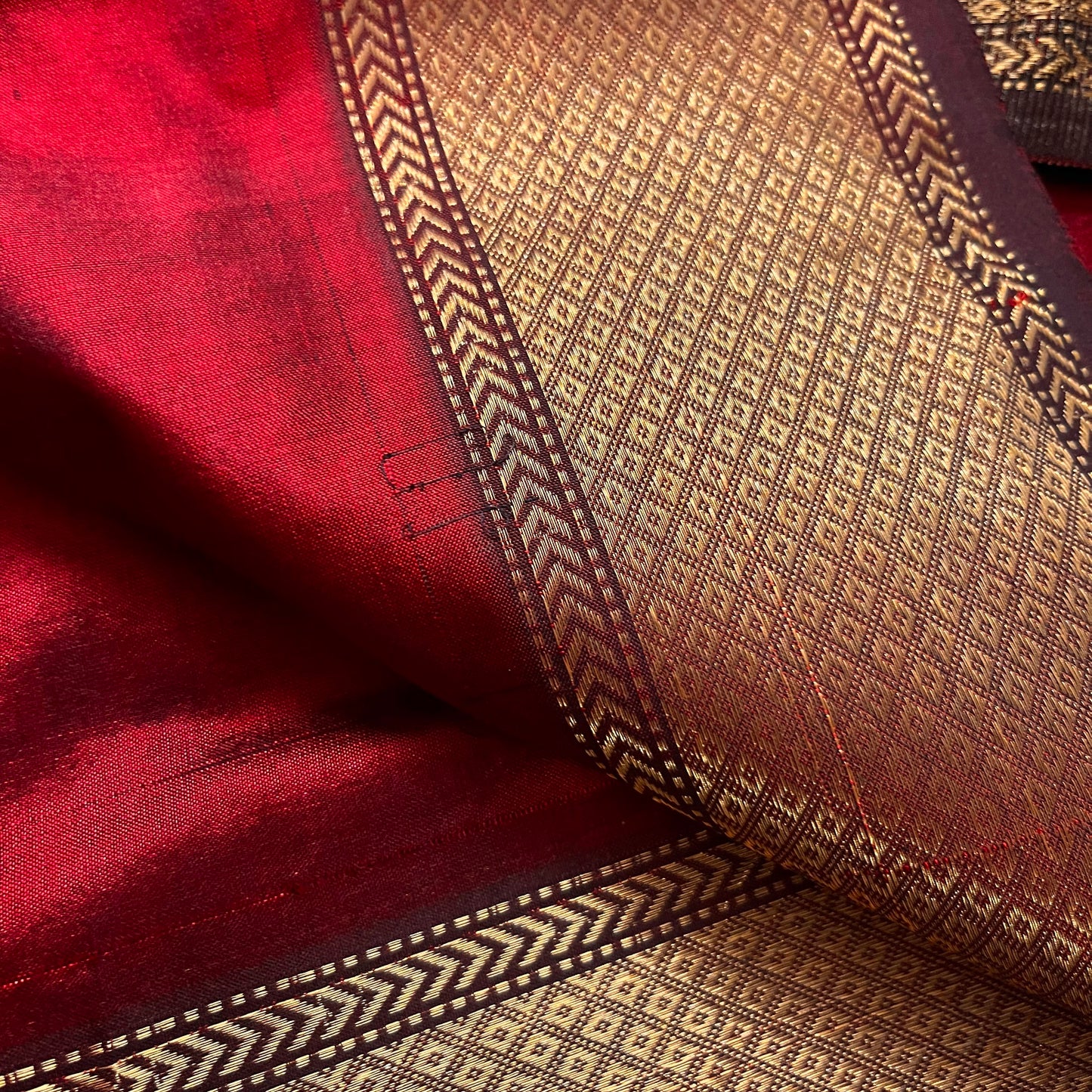 Deep maroon Maheshwari silk saree with zari bootis all over