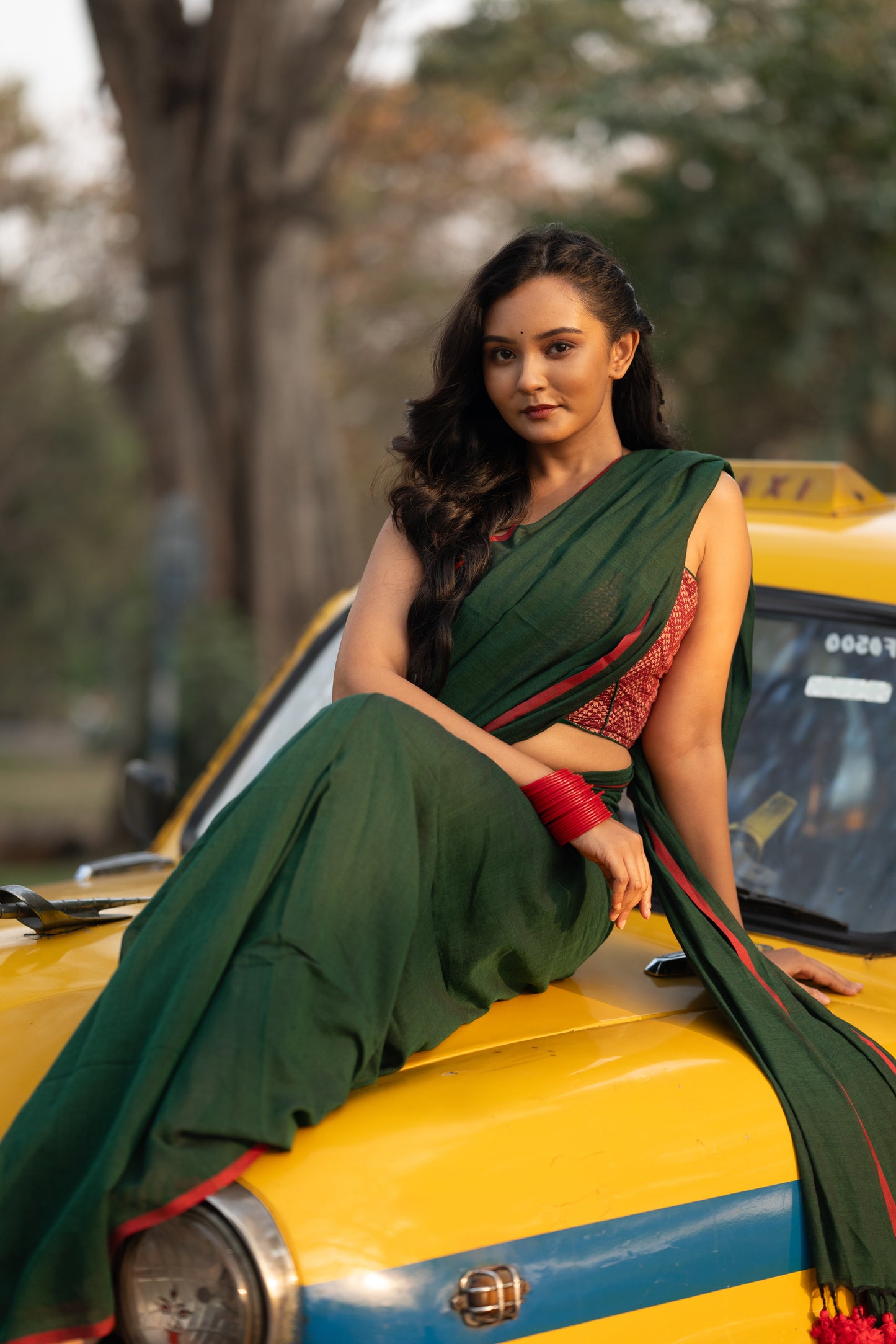 Dark green and red mulmul saree