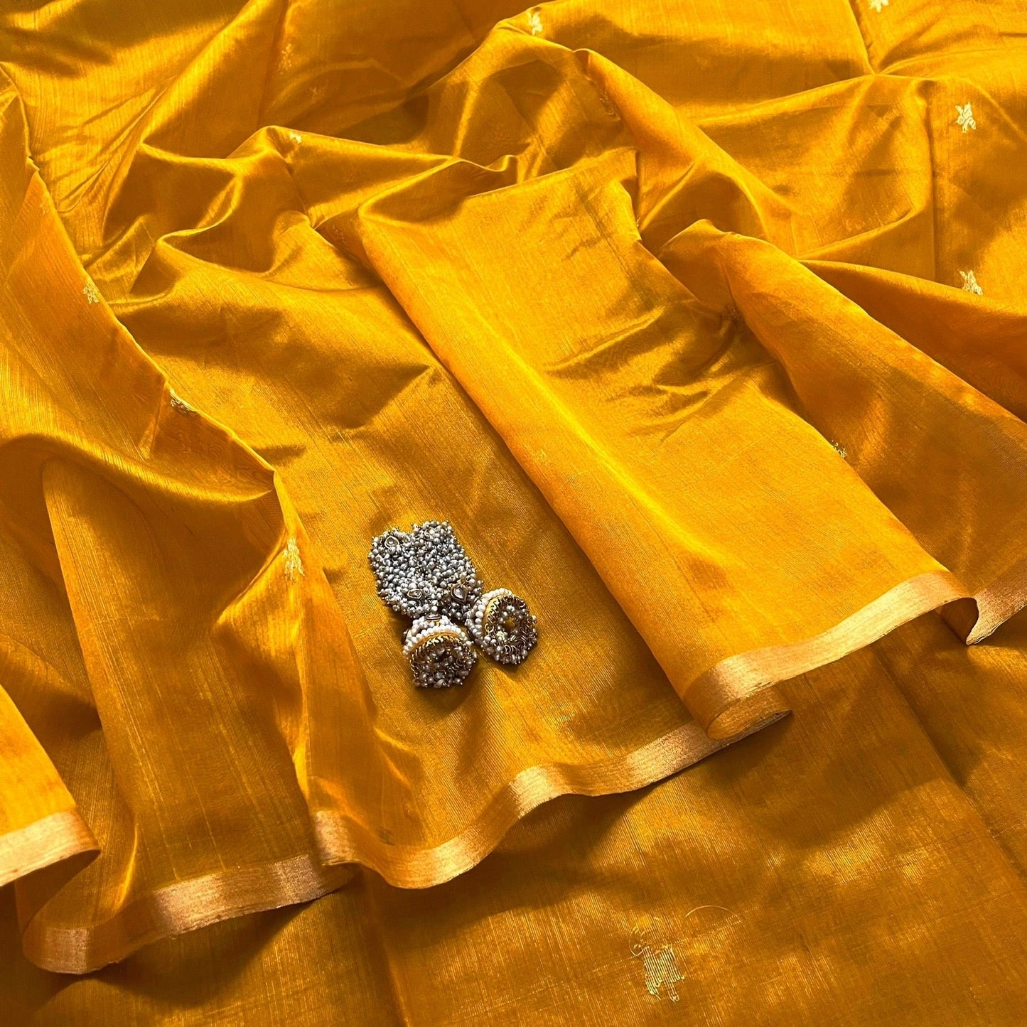 Mustard gold chanderi silk saree with flower bootis all over