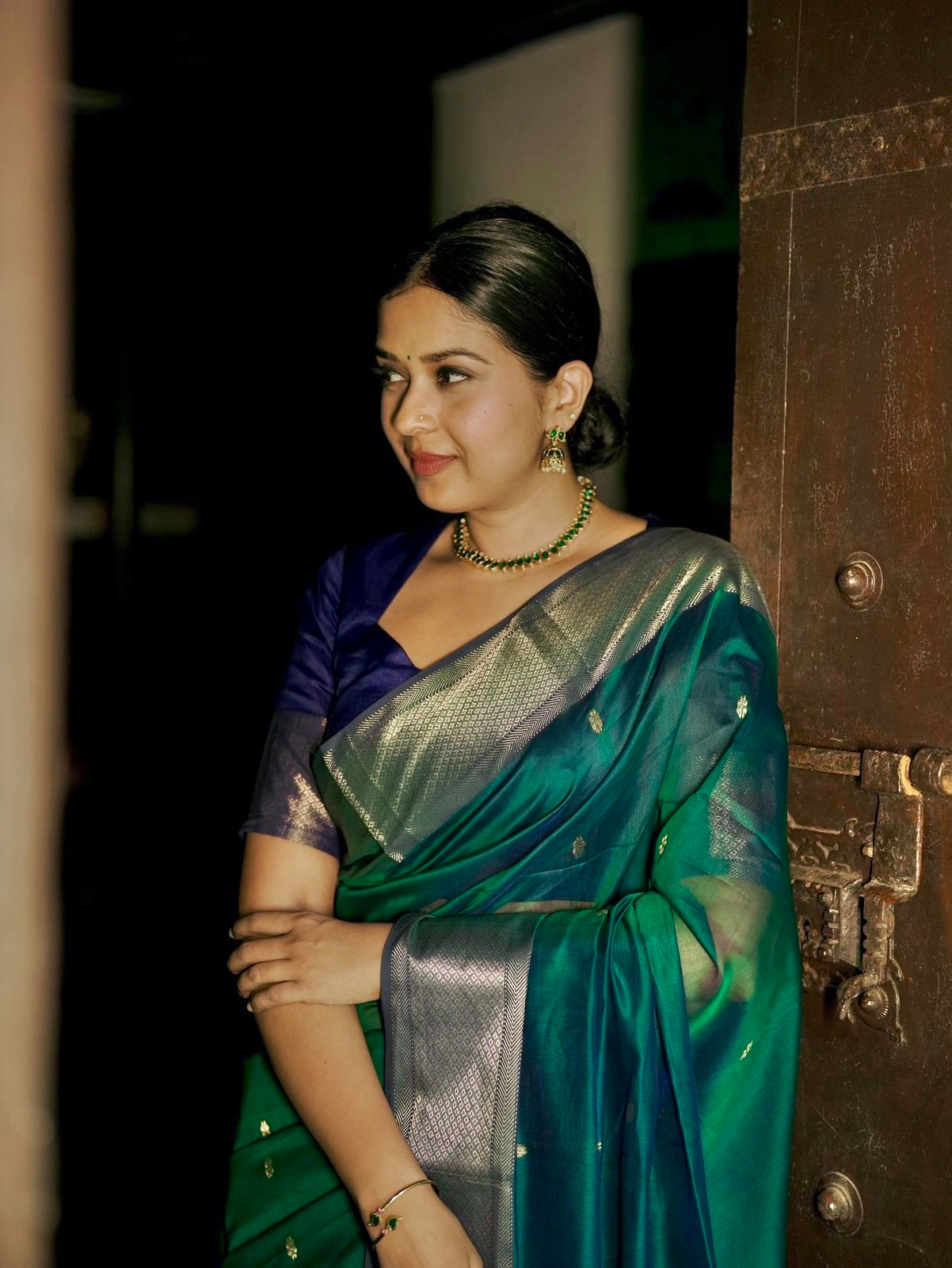 Dark Green and blue maheshwari dual tone saree with flower bootis all over