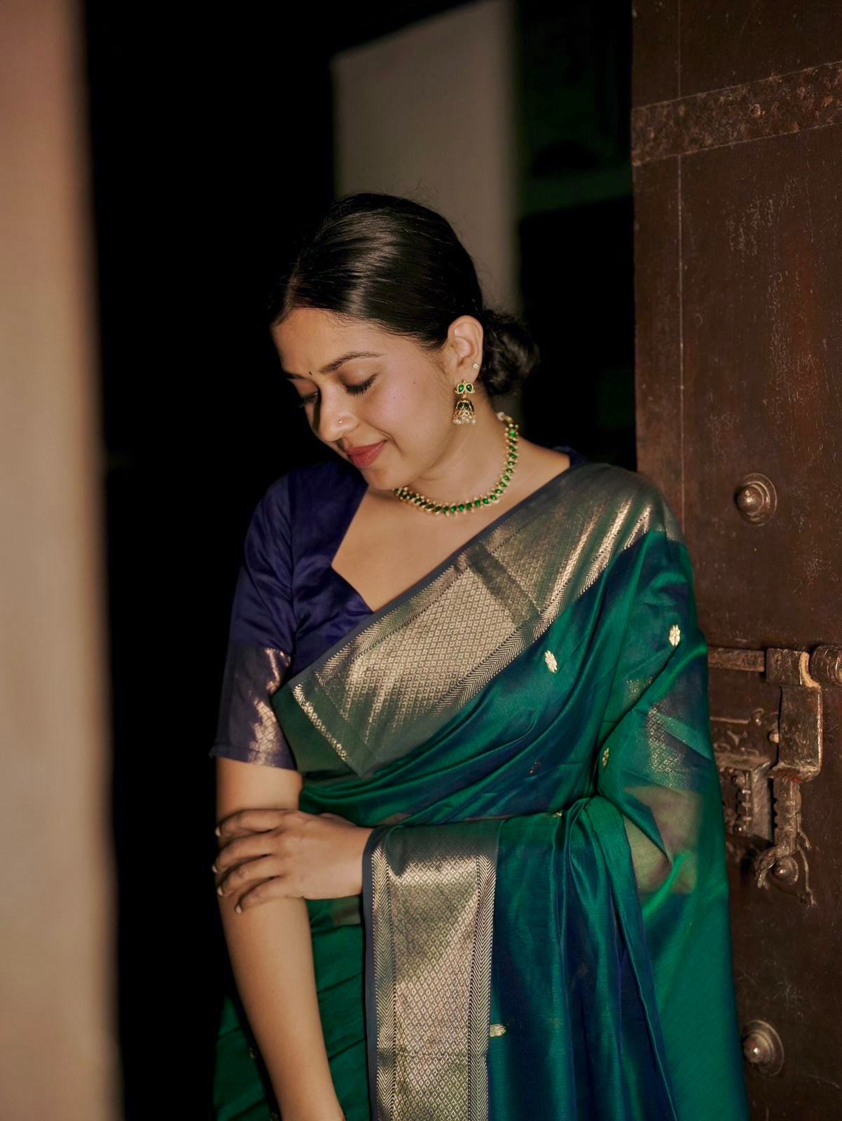 Dark Green and blue maheshwari dual tone saree with flower bootis all over