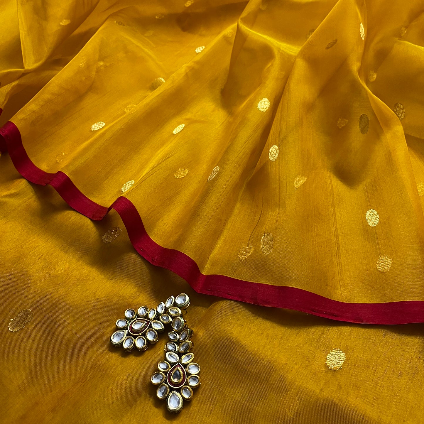 Mustard red Chanderi silk saree with zari bootis all over