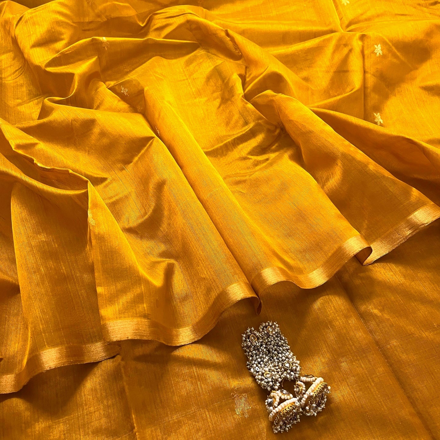 Mustard gold chanderi silk saree with flower bootis all over