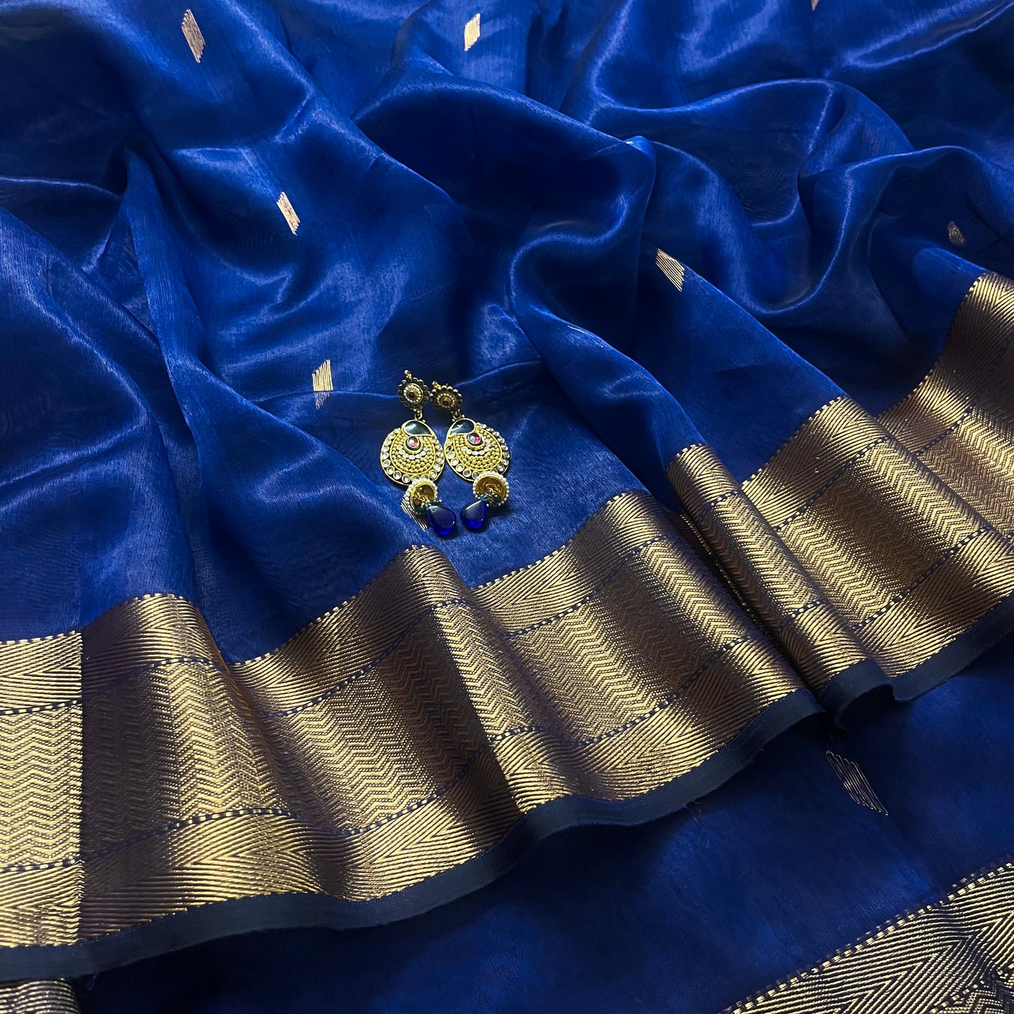 Dark blue Maheshwari tissue silk saree with zari bootis all over