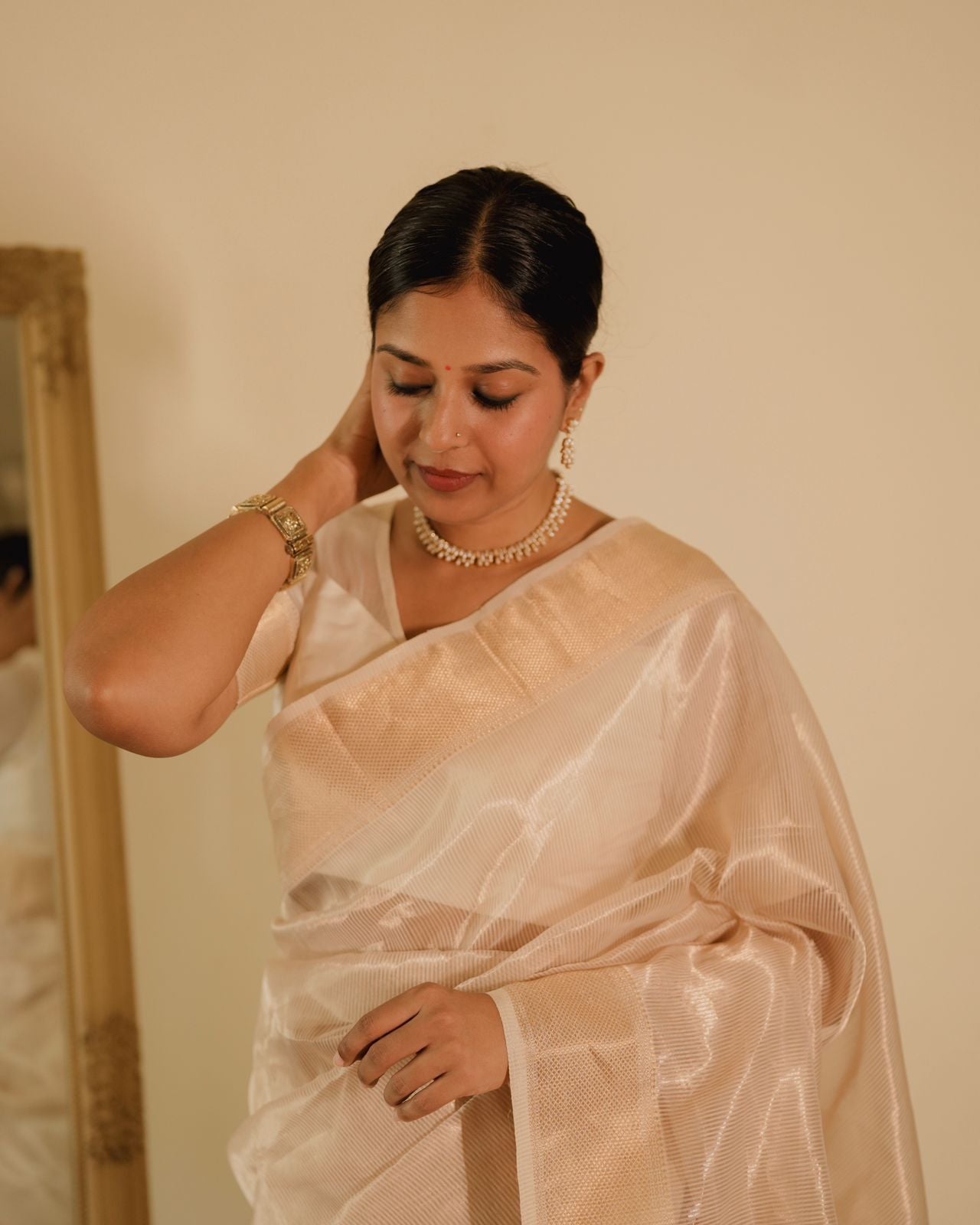 Off white gold Maheshwari saree with zari lines all over