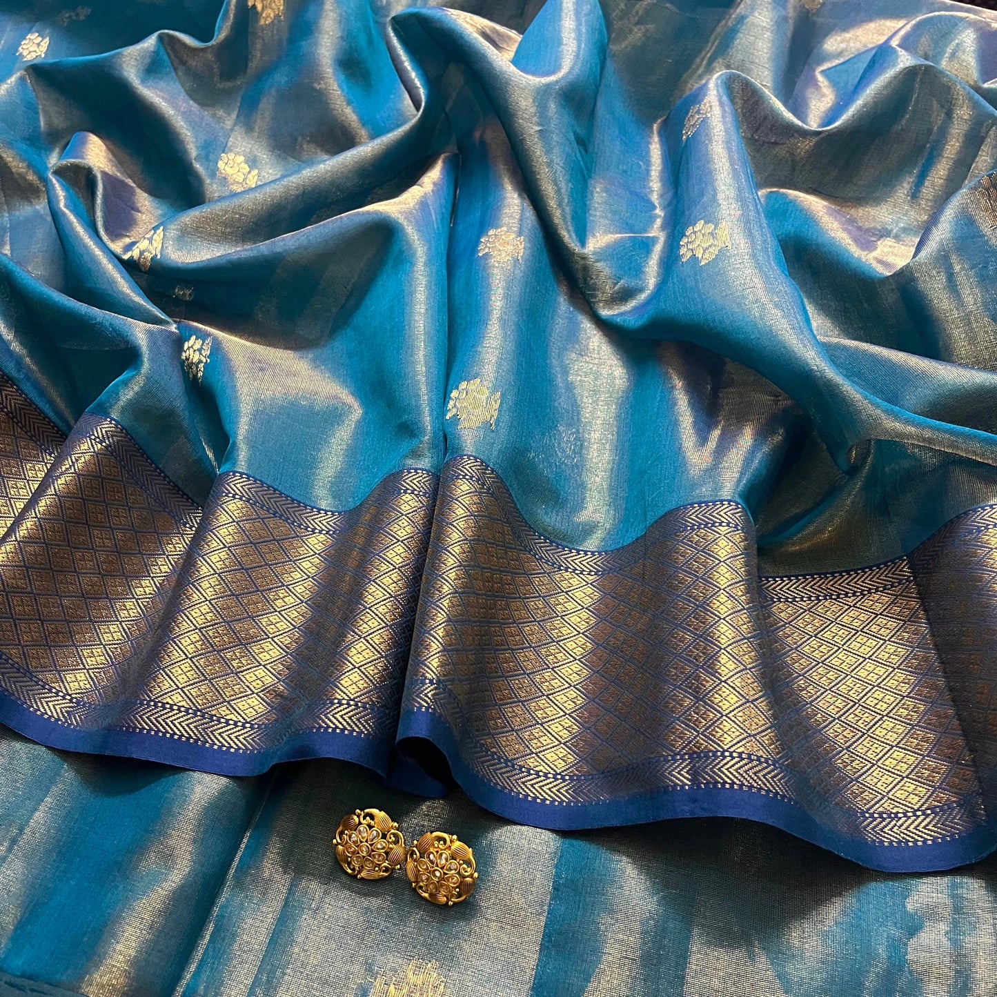 Peacock blue maheshwari tissue silk saree with flower motifs all over
