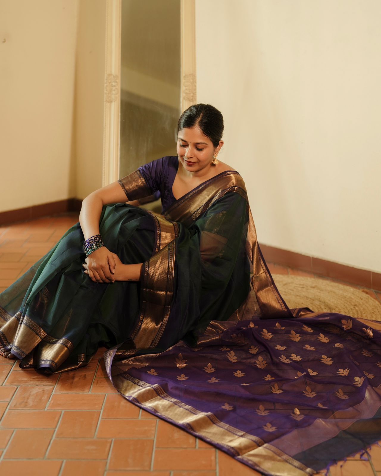 Peacock and purple dual tone Maheshwari saree with flower motifs on pallu
