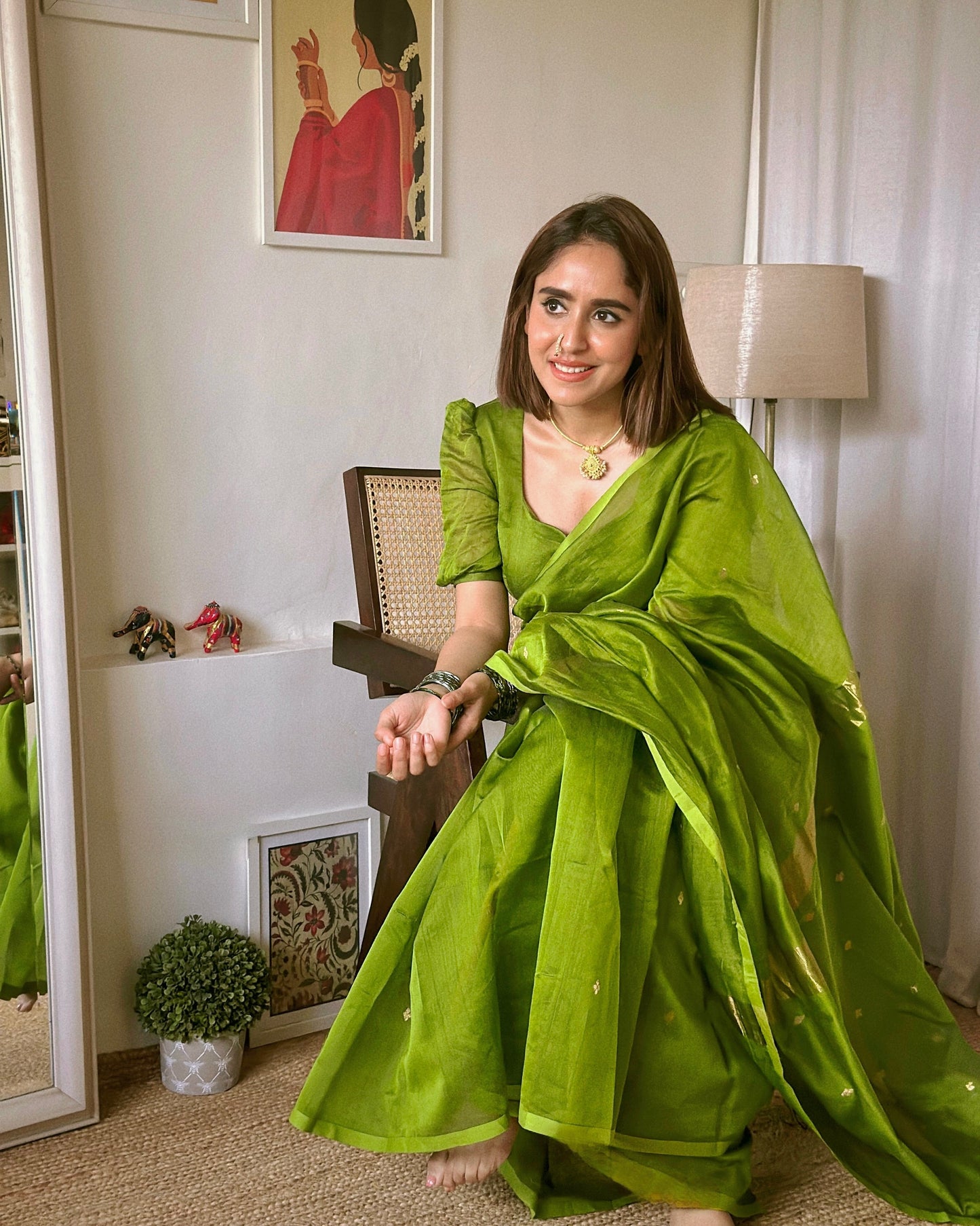 Olive green maheshwari saree with zari bootis all over