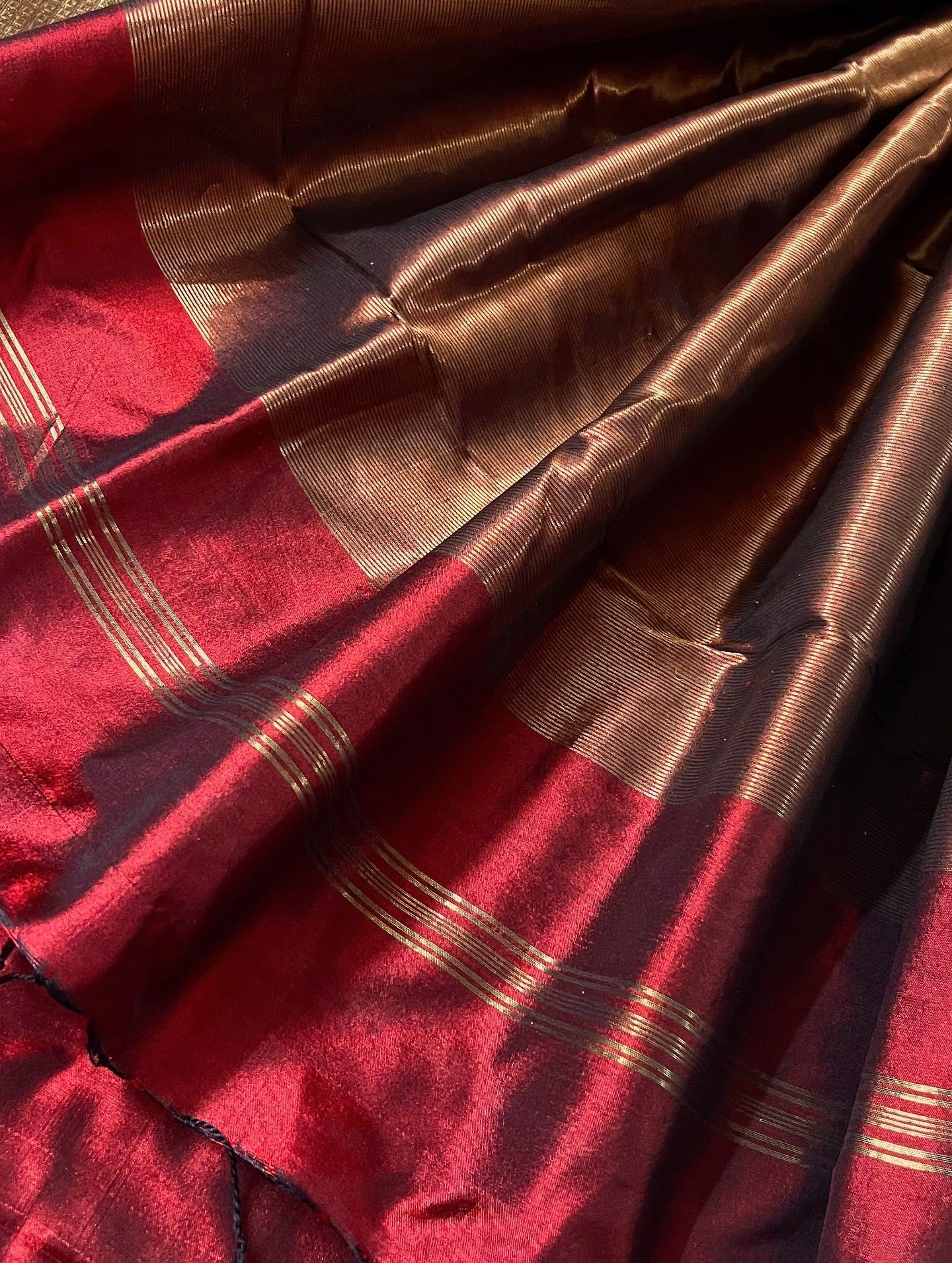 Deep maroon Maheshwari silk saree with zari bootis all over