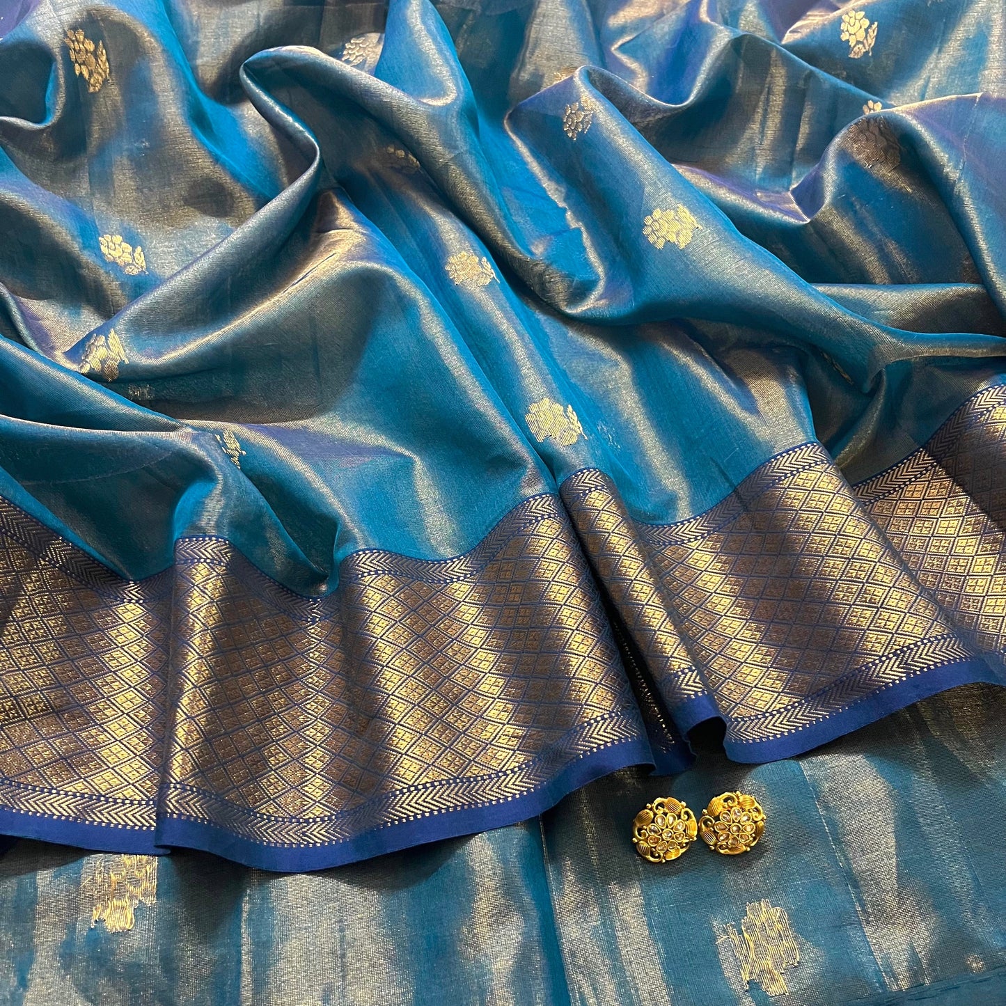 Peacock blue maheshwari tissue silk saree with flower motifs all over