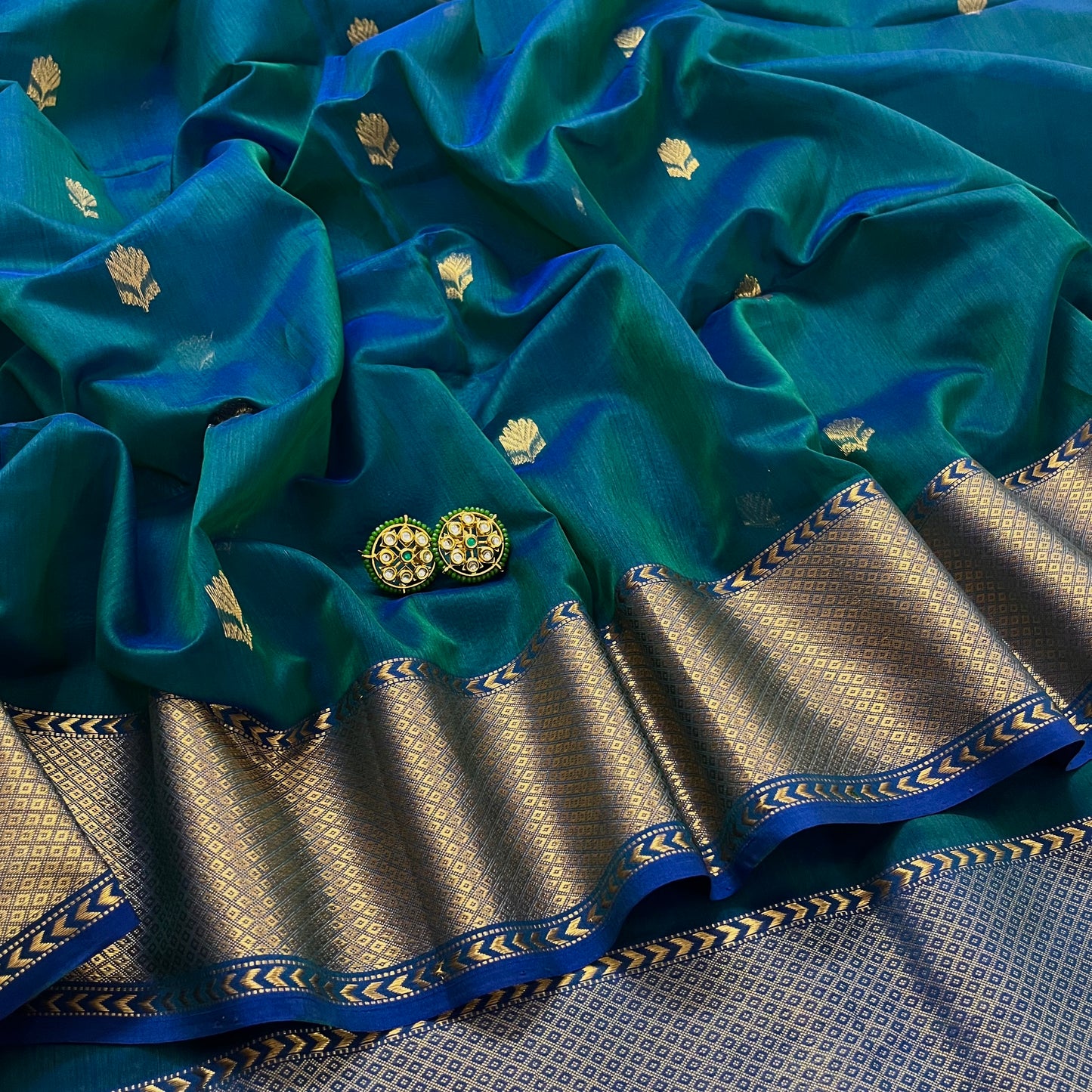 Peacock green & blue dual tone maheshwari saree with flower motifs all over