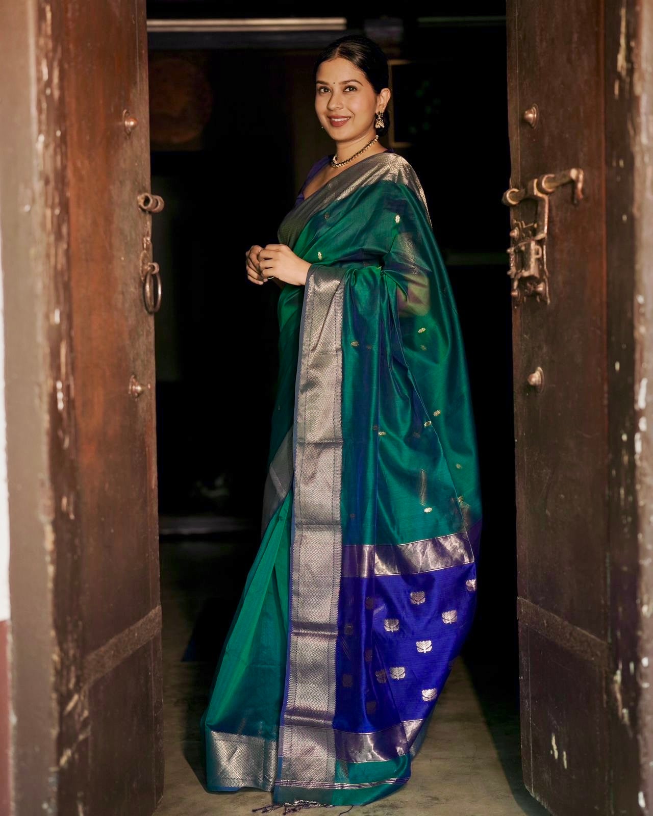 Dark Green and blue maheshwari dual tone saree with flower bootis all over