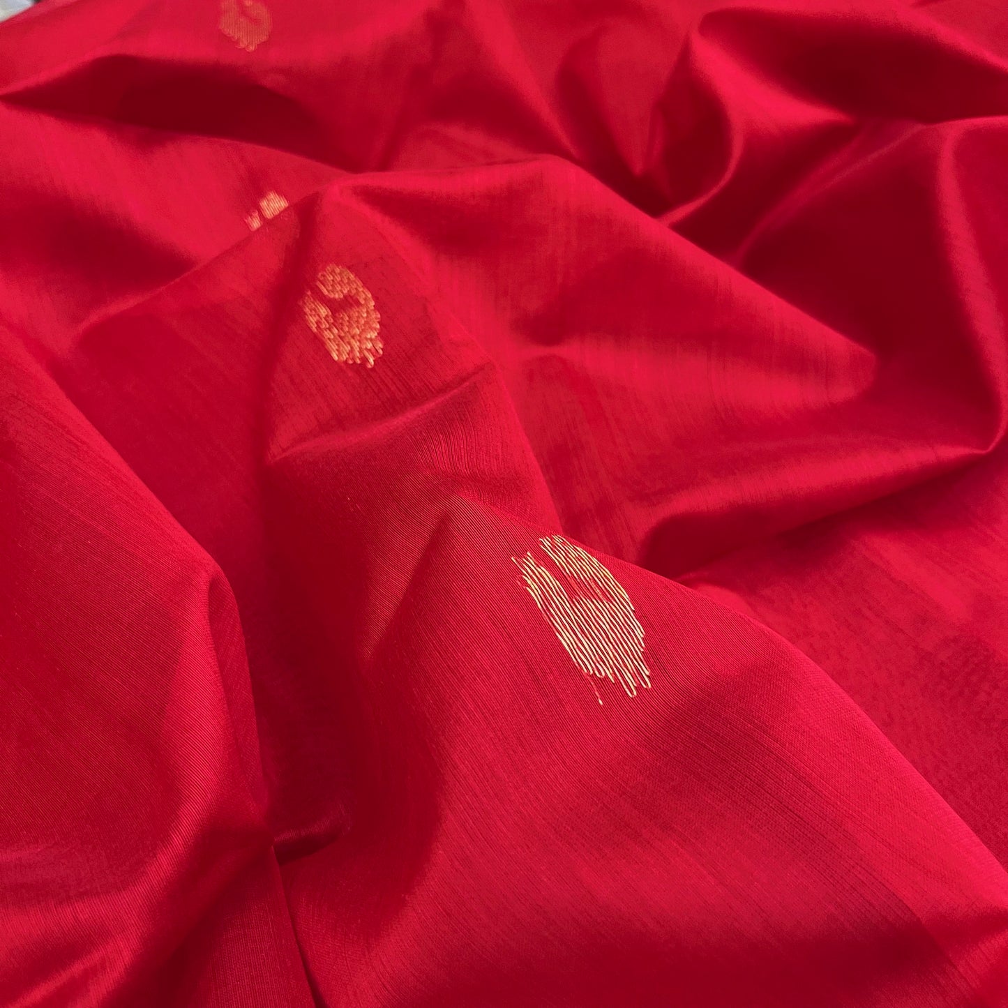 Red Maheshwari saree with morni motifs all over