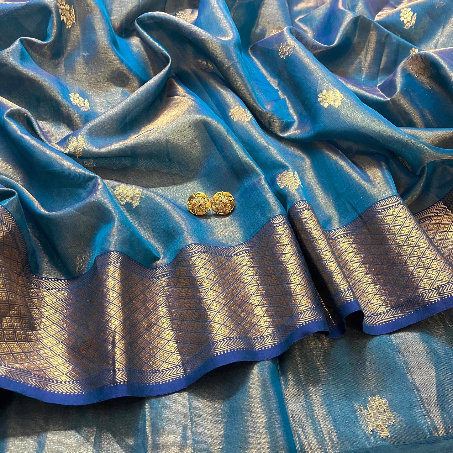 Peacock blue maheshwari tissue silk saree with flower motifs all over