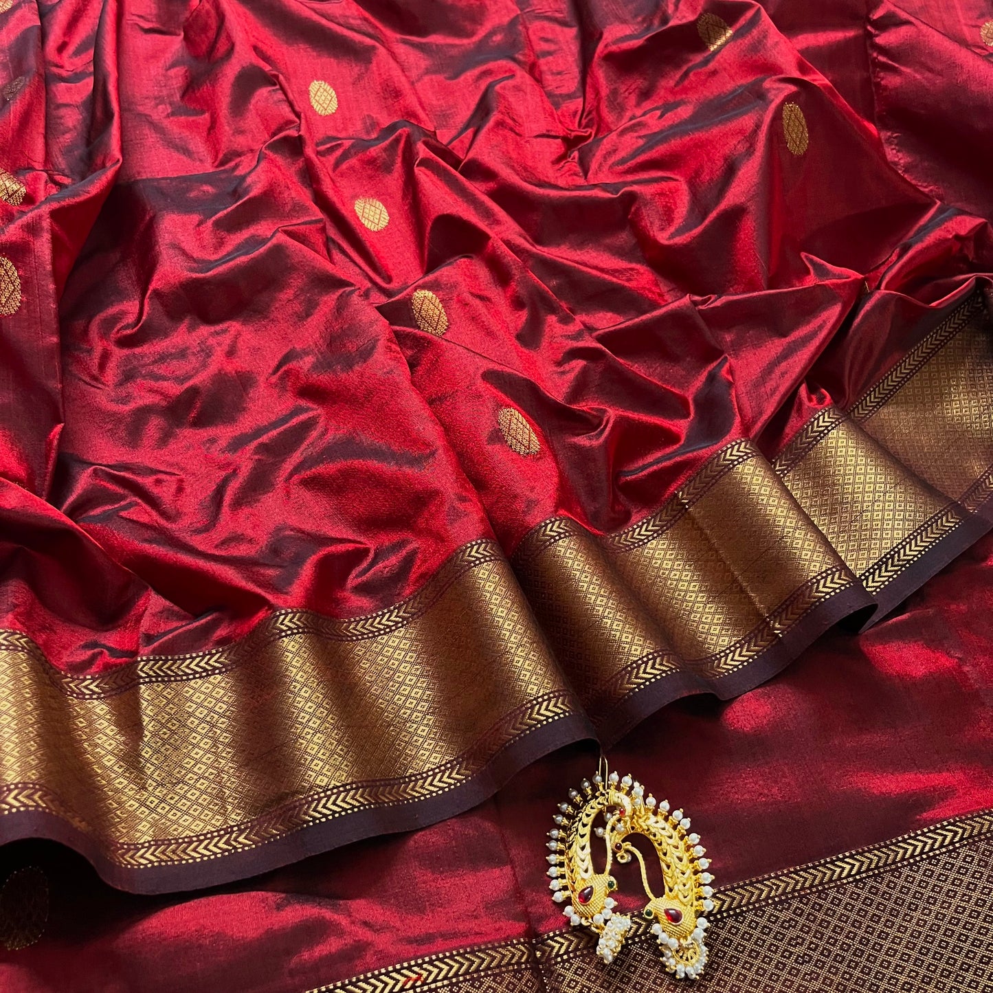 Deep maroon Maheshwari silk saree with zari bootis all over