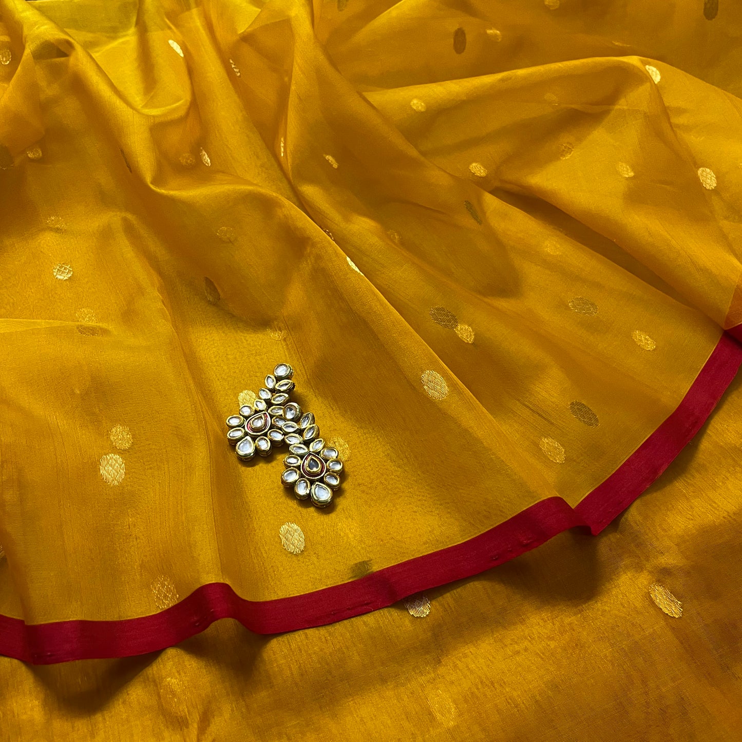 Mustard red Chanderi silk saree with zari bootis all over