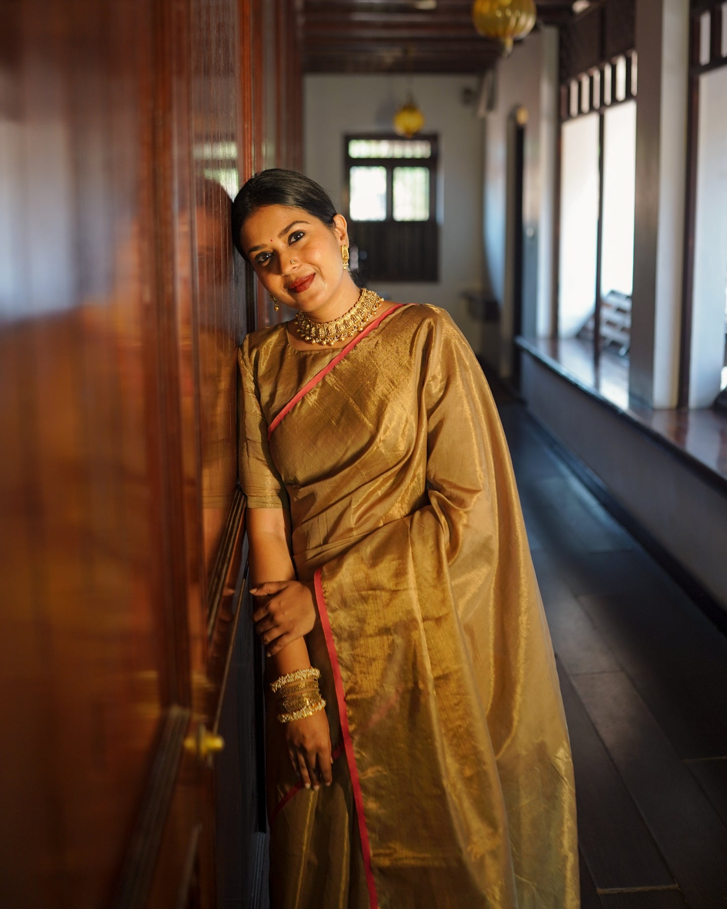Antique gold & pink maheshwari tissue silk saree with zari lines on pallu