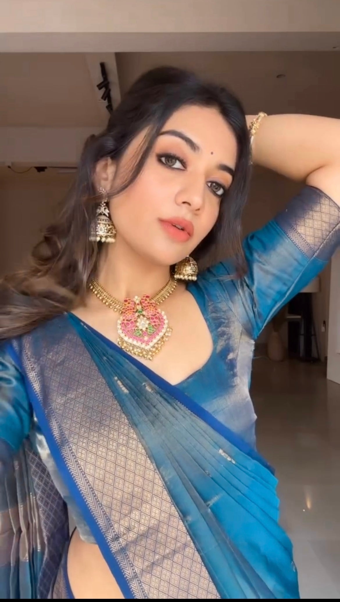 Peacock blue maheshwari tissue silk saree with flower motifs all over