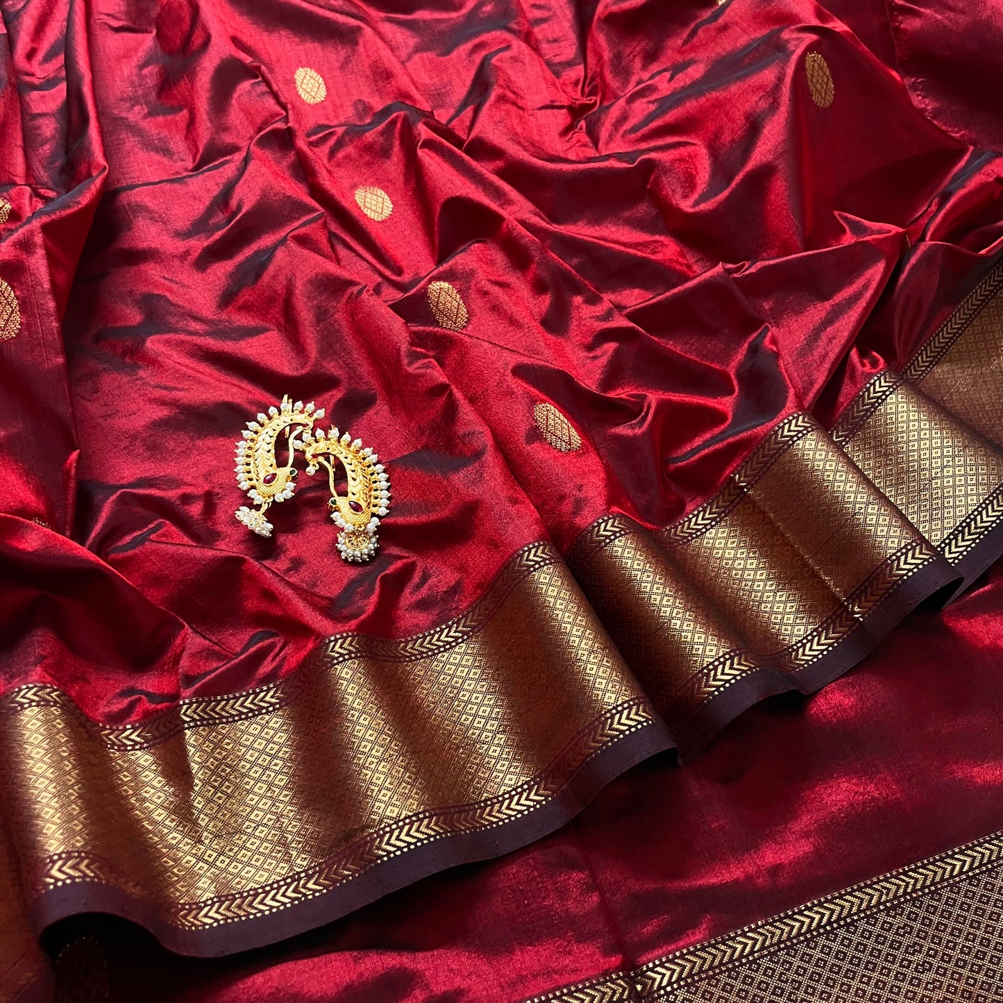 Deep maroon Maheshwari silk saree with zari bootis all over