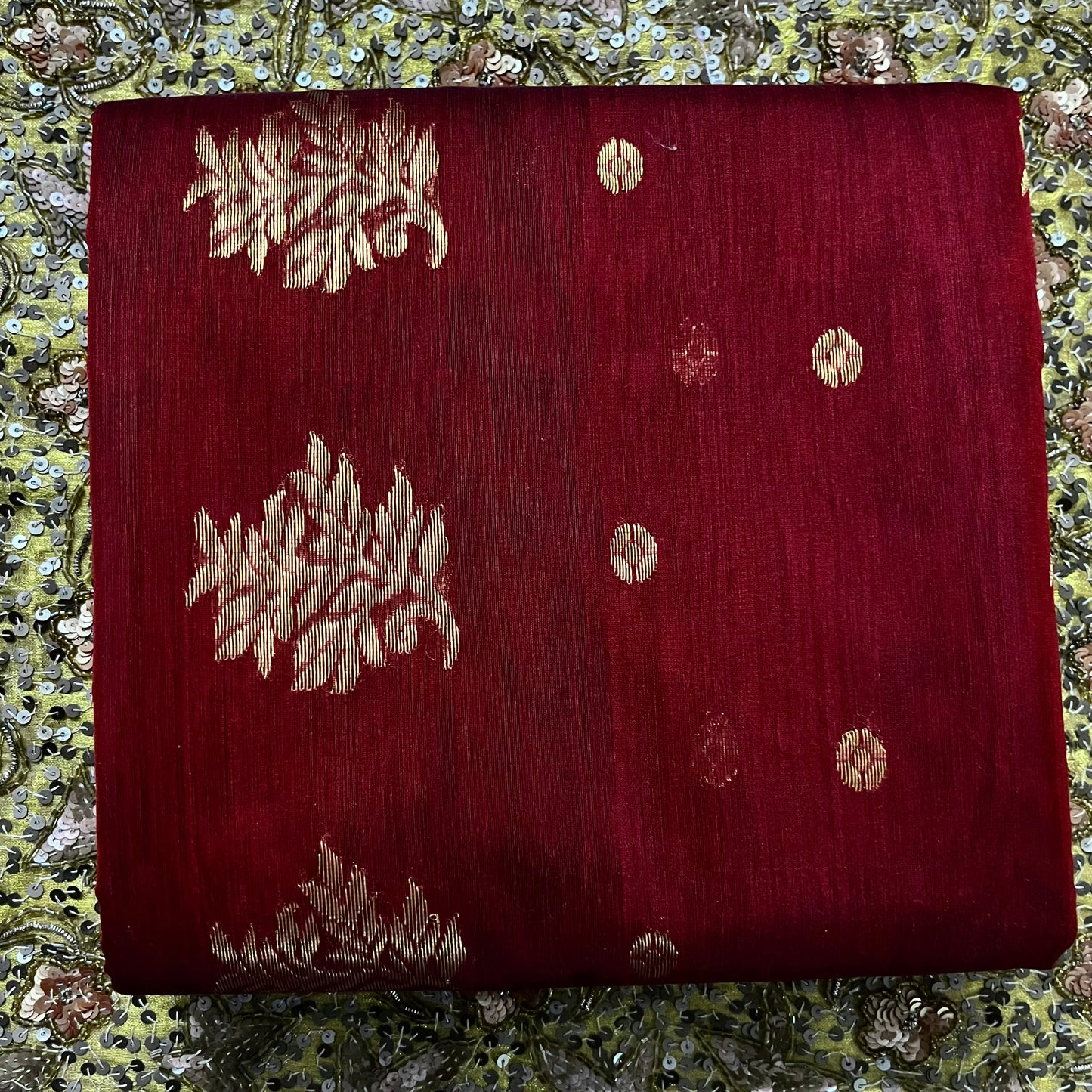 Deep maroon Chanderi saree with zari bootis all over and flower motifs on pallu
