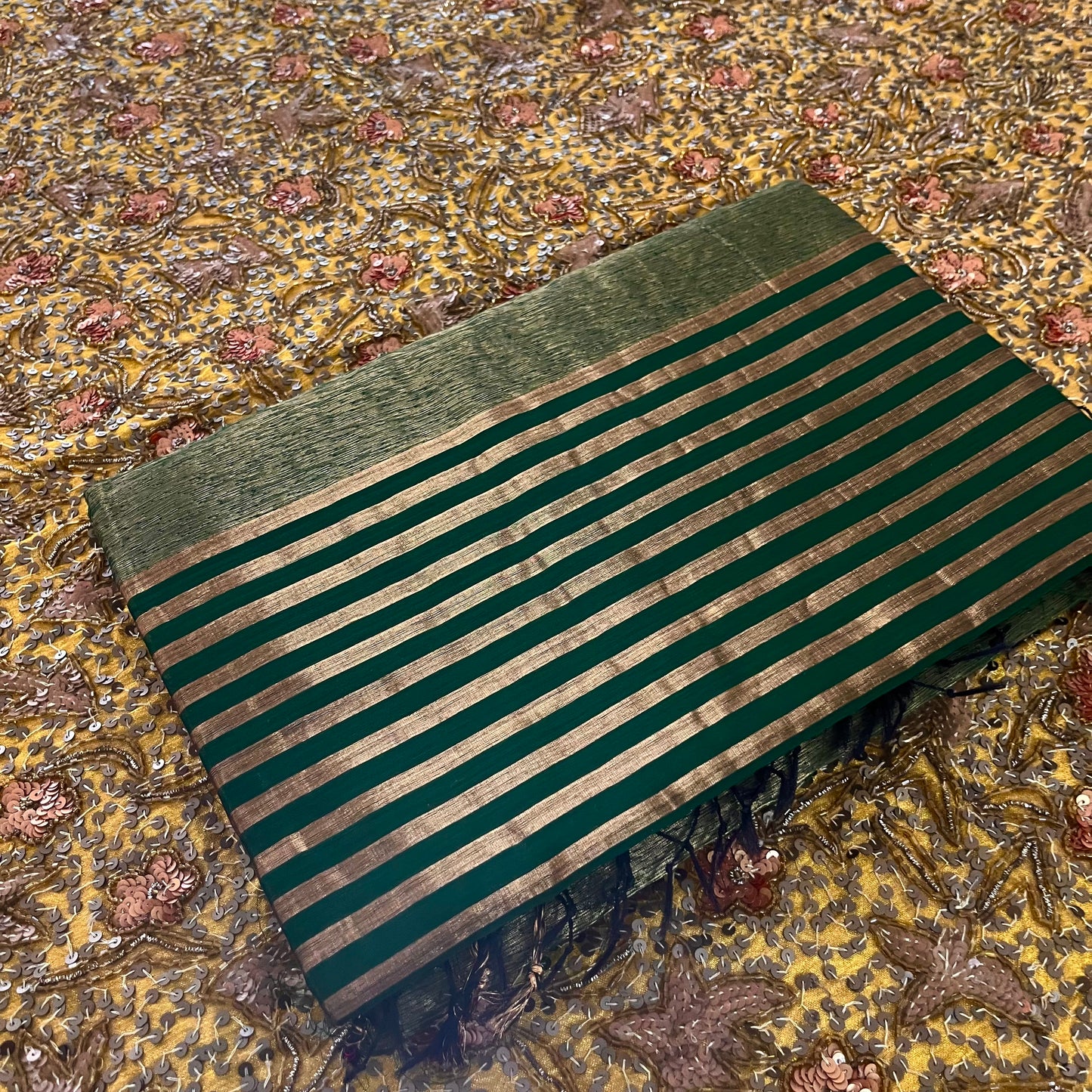 Dark green Maheshwari saree with zari stripes all over