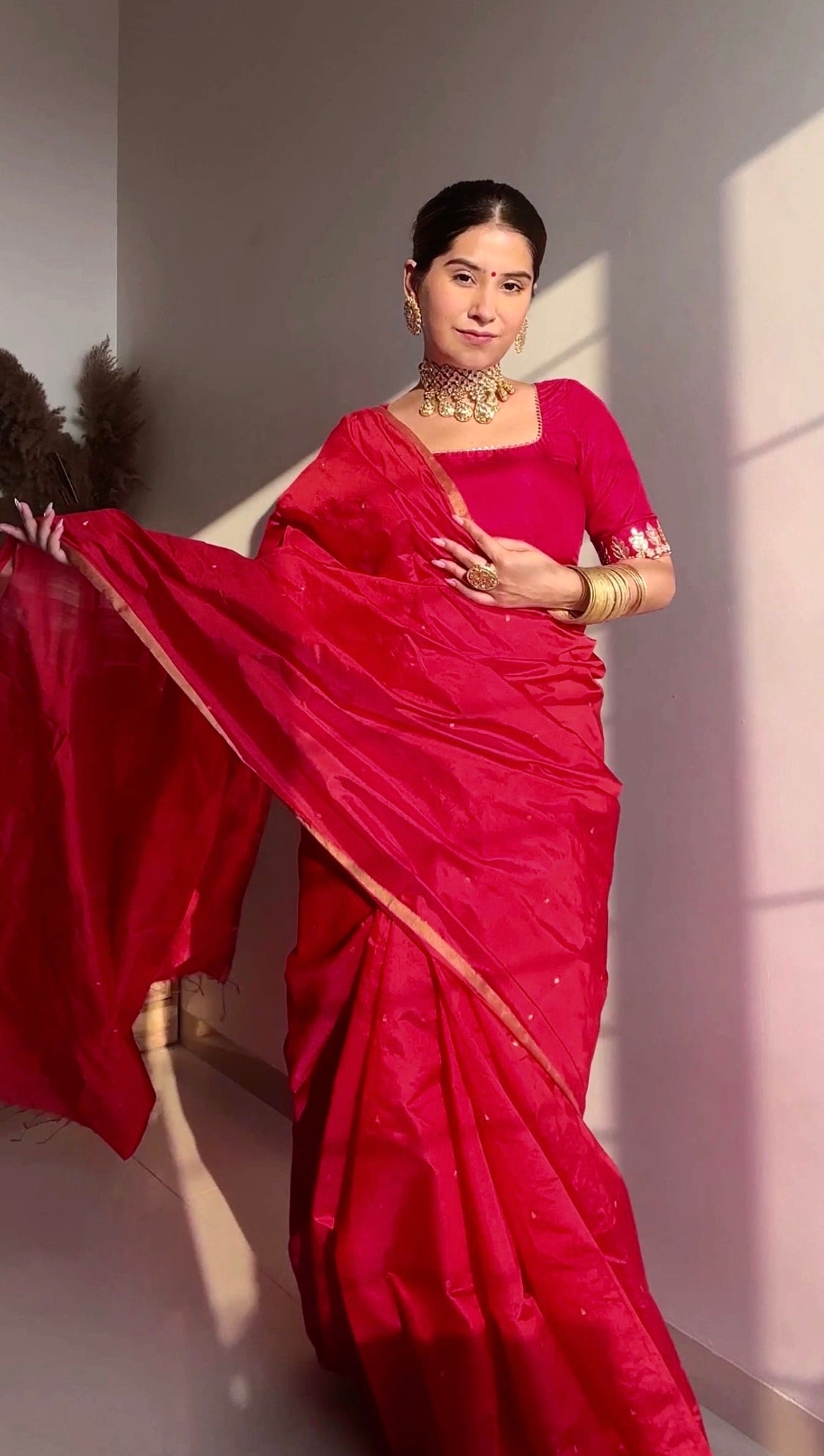 Crimson red chanderi silk saree with zari bootis all over