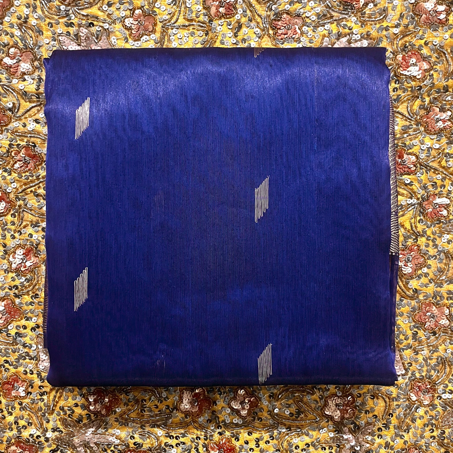 Dark blue Maheshwari tissue silk saree with zari bootis all over